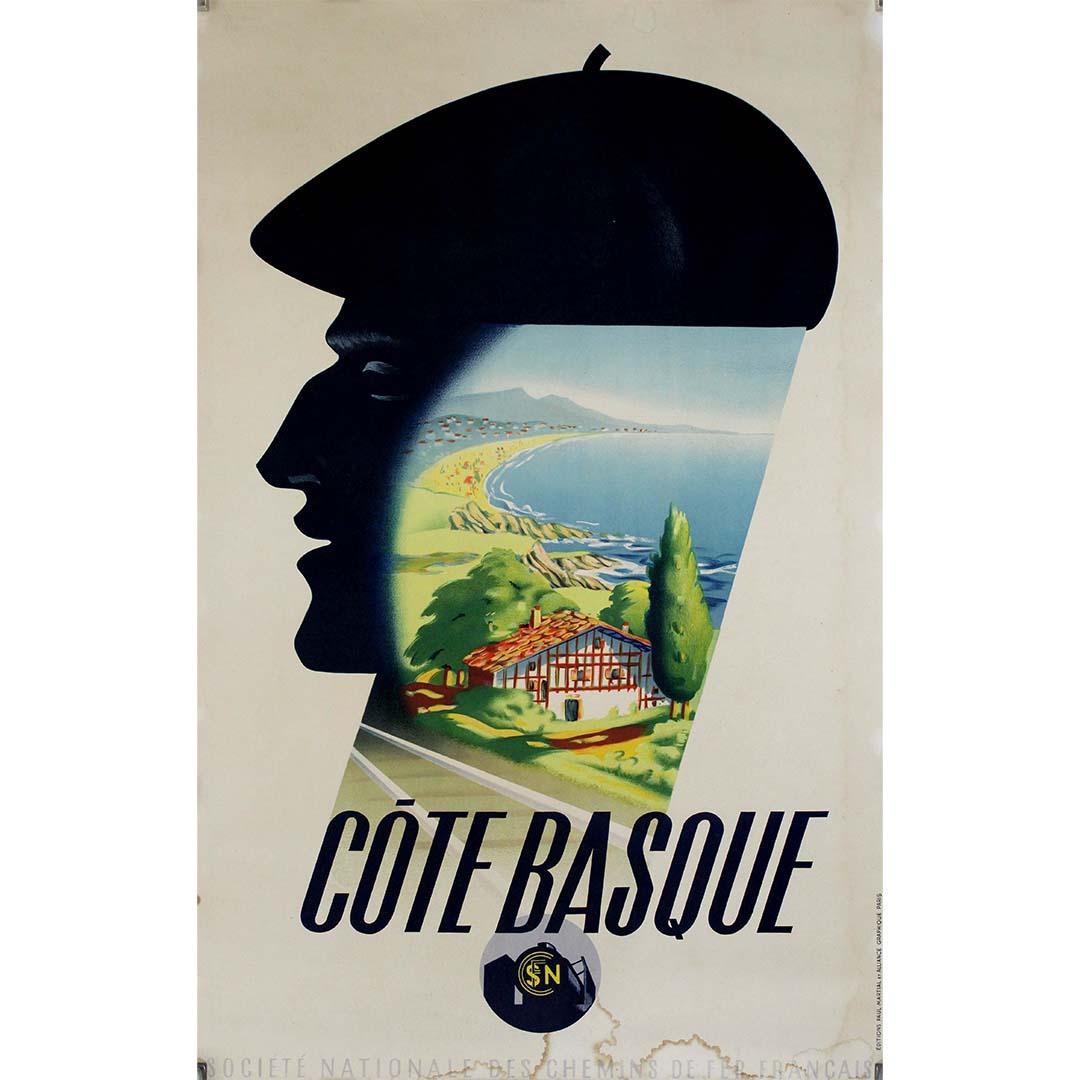 L'affiche de voyage originale créée par Roland Hugon pour la Société Nationale des Chemins de Fer Français (SNCF) afin de promouvoir le voyage sur la Côte Basque capture l'attrait et le charme de cette destination côtière pittoresque. Réalisée avec