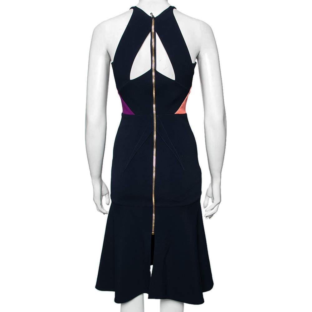 Look absolutely chic and colorful as you don this gorgeous Roland Mouret creation. Tailored using color block stretch crepe fabric, this Kennard dress displays a halter neck style with cut-out detailing at the back. An elongated zipper fastening