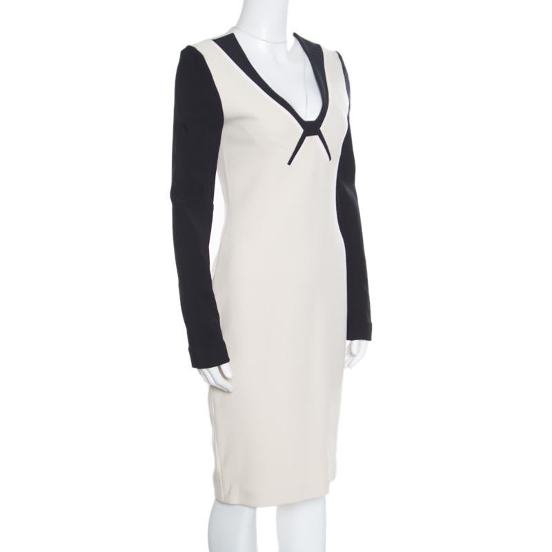 This lovely Kutim dress from Roland Mouret is made of a blend of fabrics and features a simple colourblock knit design. It flaunts a deep neckline, long sleeves and a gold-tone zipper at the back. The fabulous creation can be paired well with