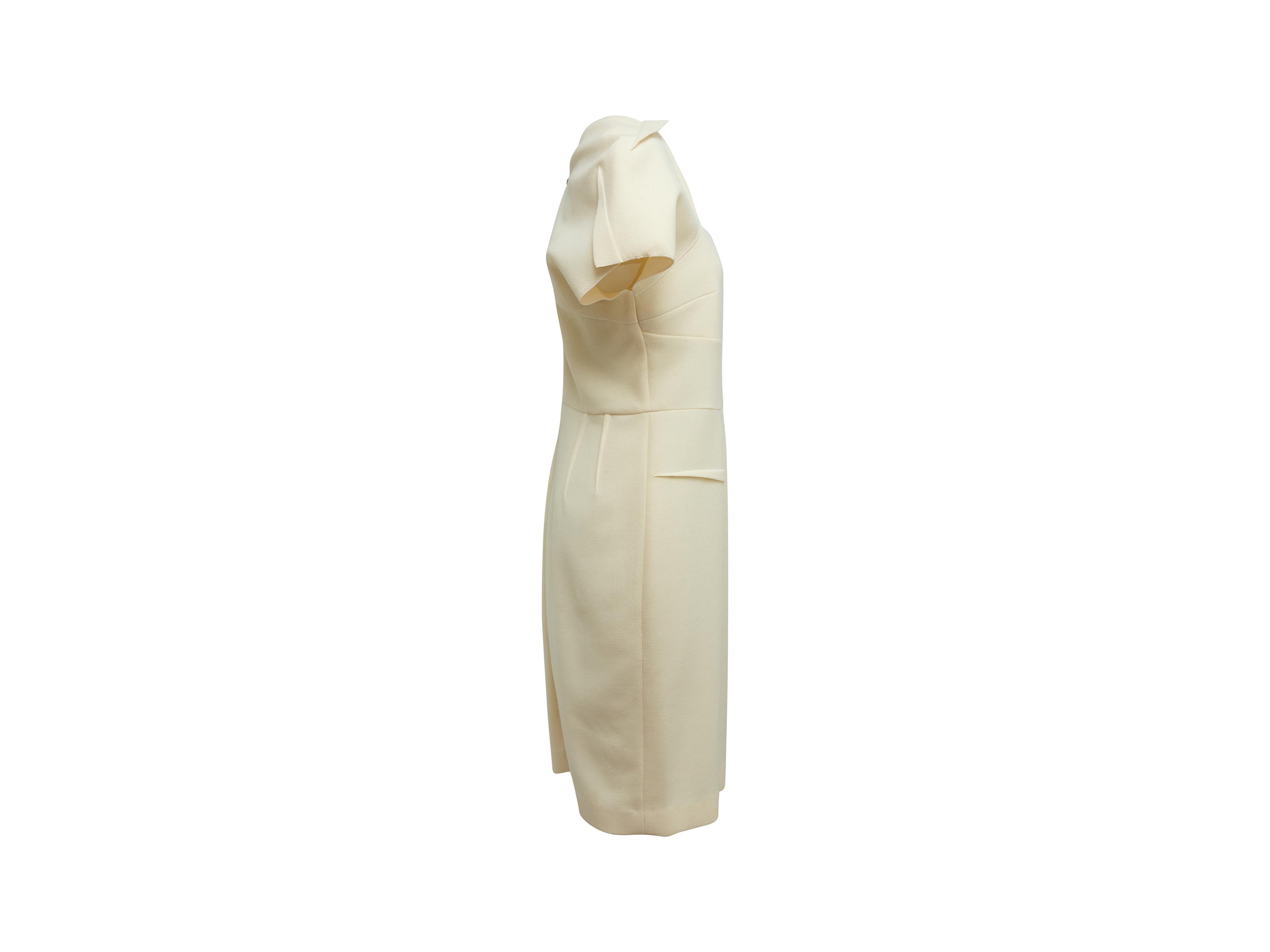 Product details: Cream wool midi dress by Roland Mouret. Short sleeves. Tonal stitching throughout. Exposed zip closure at back. 37