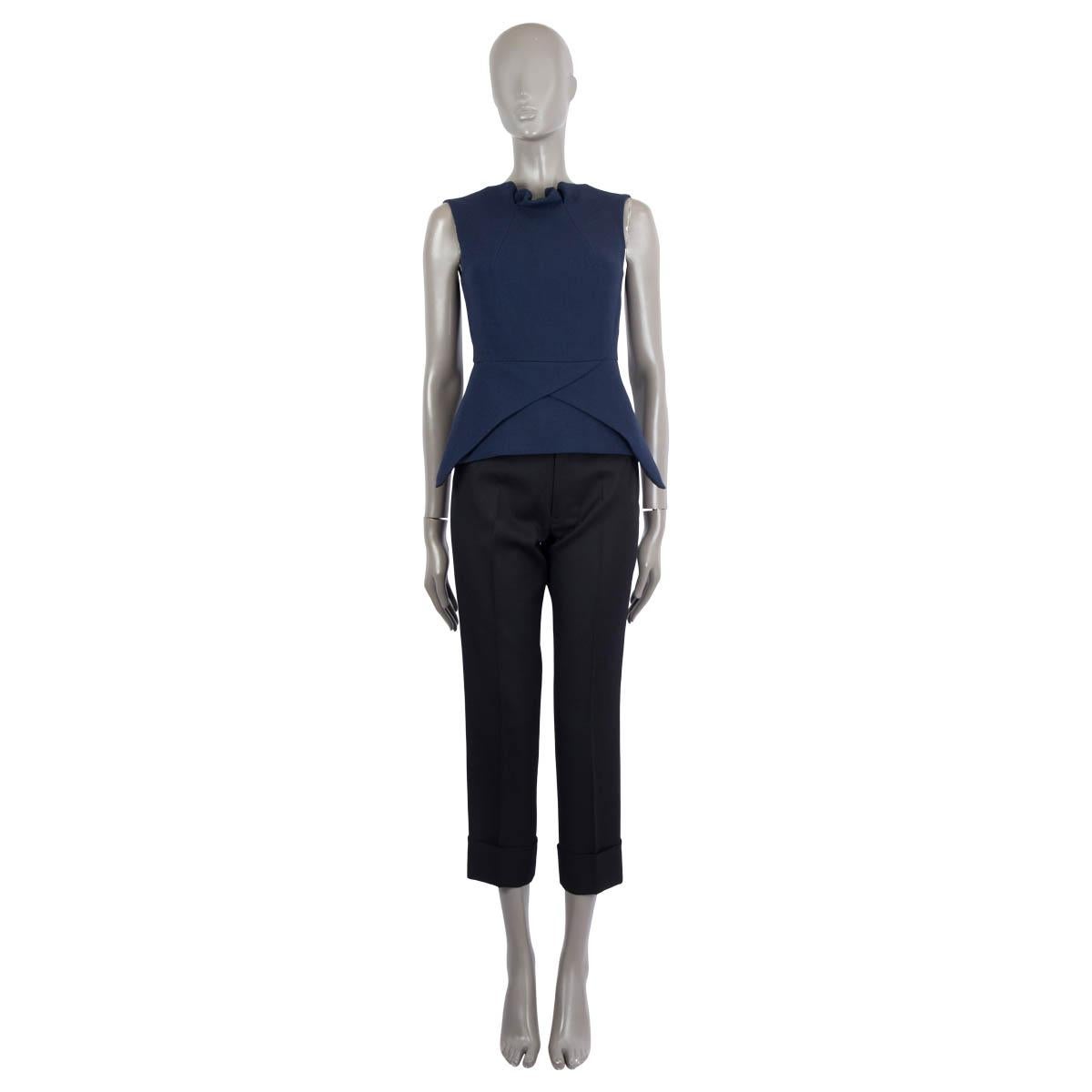 100% authentic Roland Mouret sleeveless structured top in navy blue wool (100%). Opens with a zipper on the back and is lined in black silk (26%), acetate (71%) and elastane (3%). Has been worn and is in excellent condition. 

Measurements
Tag