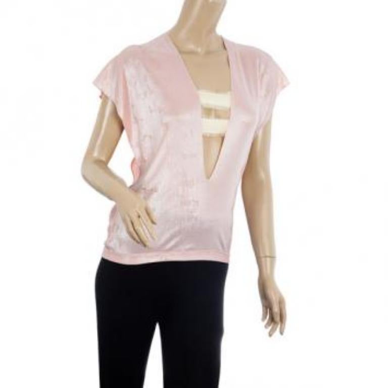 Turn all eye on you at your next party when you slip into this flirty stretch top by Roland Mouret. It is made from polyester and features front cutouts.