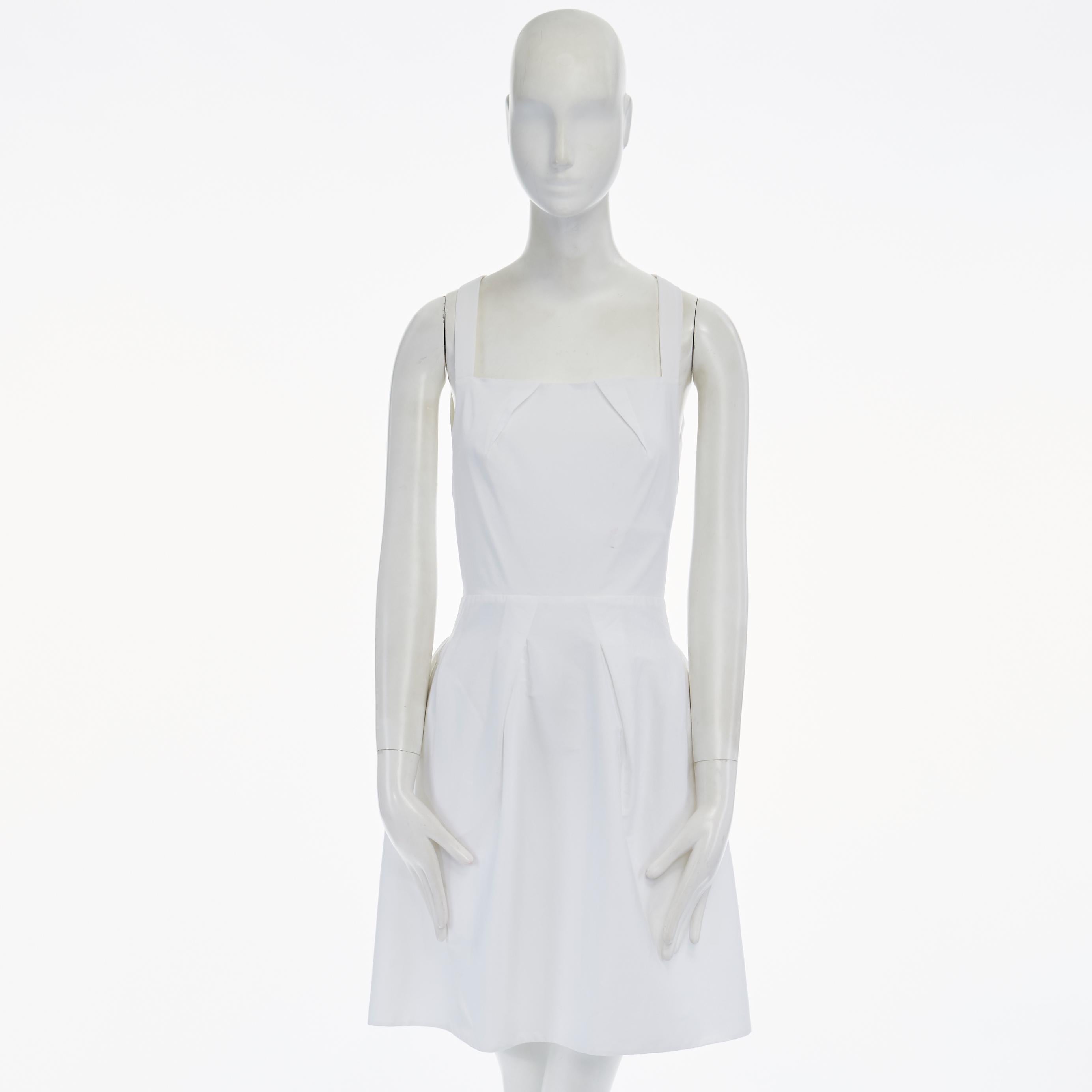 ROLAND MOURET white cotton blend origami pleat dart cut out back dress UK8 Reference: LNKO/A00415 
Brand: Roland Mouret 
Designer: Roland Mouret 
Material: Cotton 
Color: White 
Pattern: Solid 
Closure: Zip 
Made in: Portugal 

CONDITION: