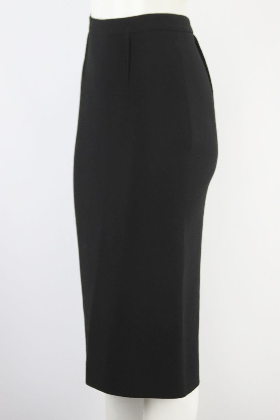 Roland Mouret wool crepe midi skirt. Black. Zip fastening at back. 100% Wool. Size: UK 10 (US 6, FR 38, IT 42). Waist: 27 in. Hips: 36 in. Length: 29.5 in Very good condition - Some marks throughout; see pictures.
