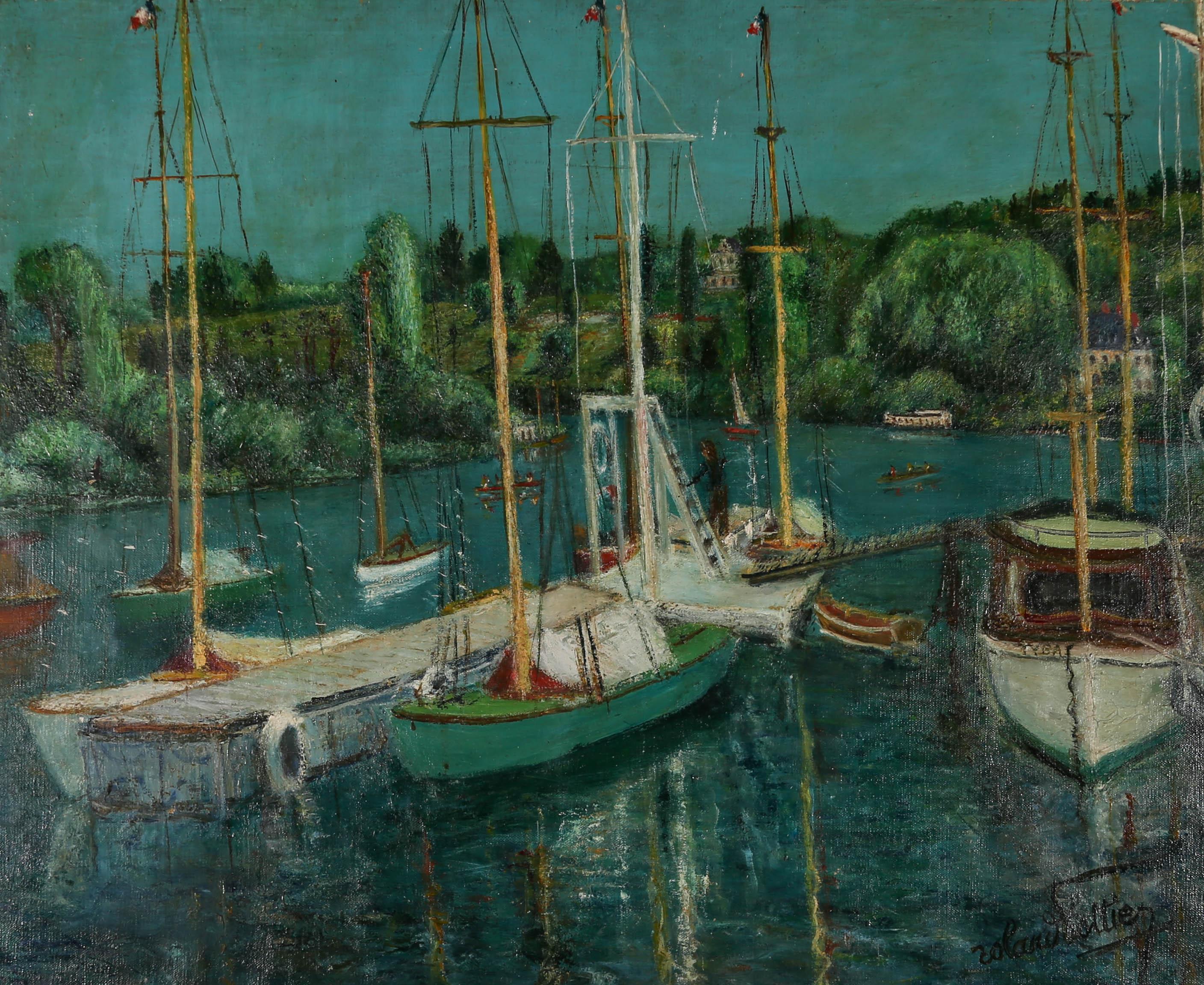 A charmingly rustic French School harbour scene in oil showing boats moored at a floating jetty with trees on the far banks. The artist has signed to the lower right corner and inscribed to the reverse stretchers with the location and name. On