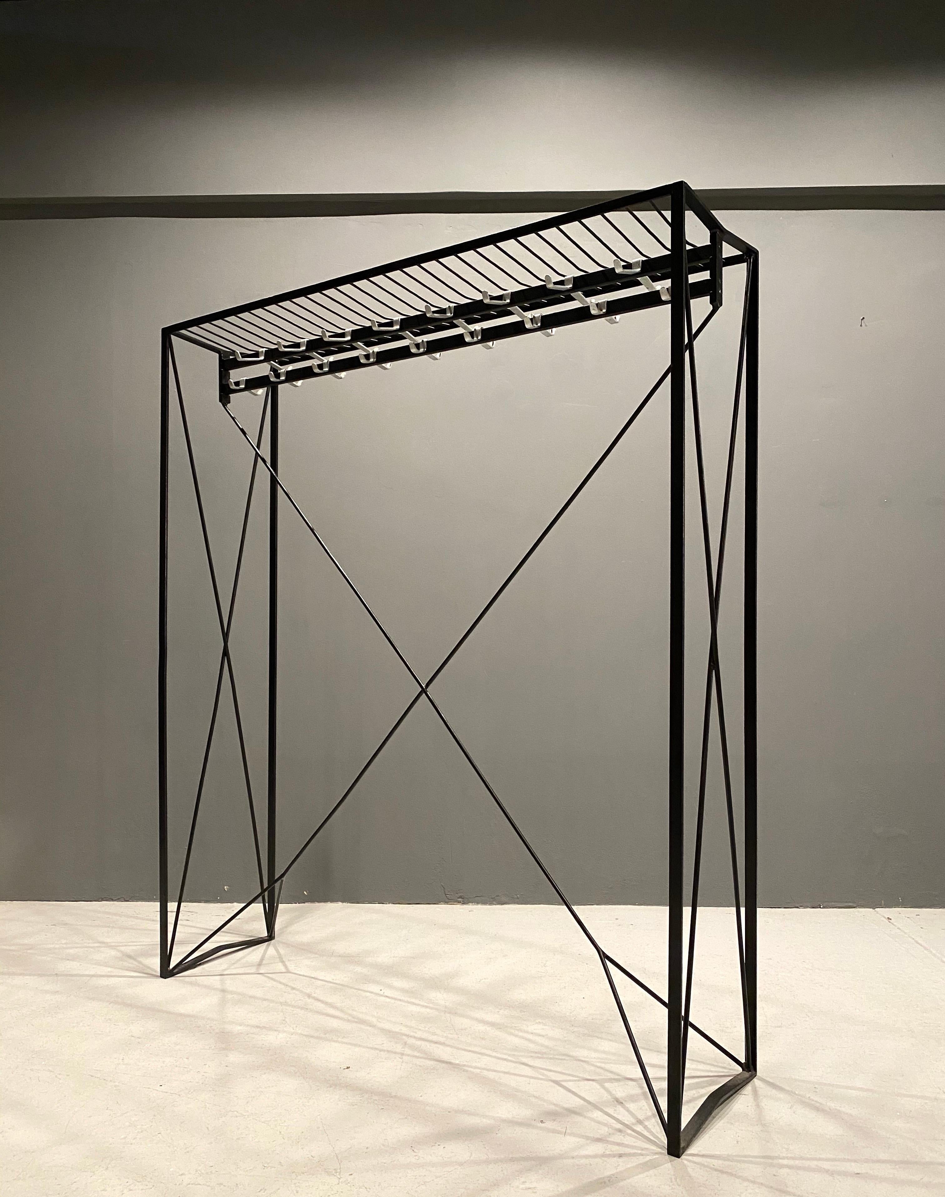 Sculptural coatrack from the historic town hall in Vienna, created by architect Roland Rainer in 1956. Only a limited number were produced.
Blackened iron structure with 17 double aluminum hooks.
Great vintage condition.