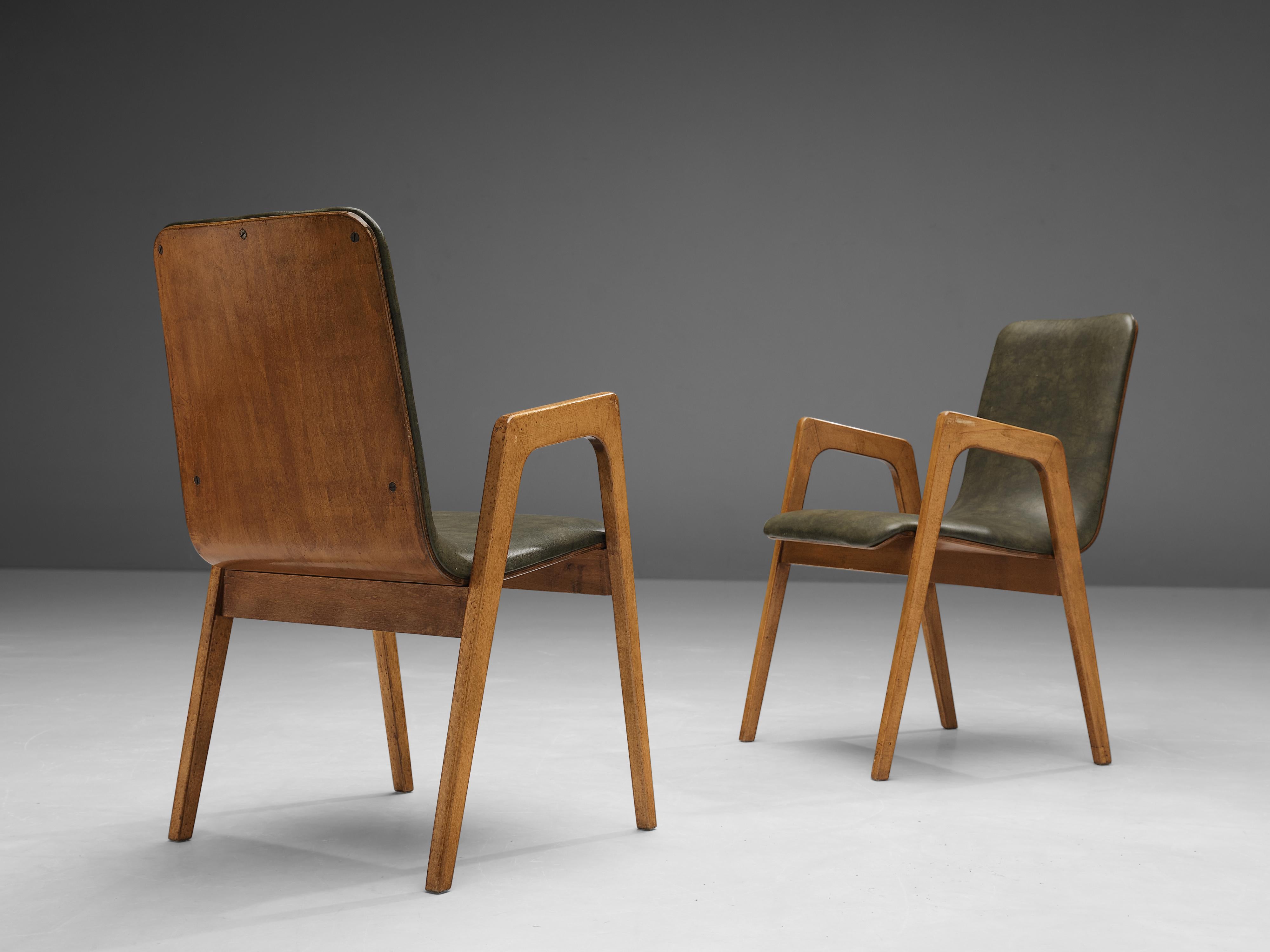 Roland Rainer, armchairs, birch, faux leather, Austria, 1960s.

These armchairs, designed by Roland Rainer, were executed to perfection and provide great comfort. These chairs look almost sculpted thanks to the exquisite woodwork of the walnut