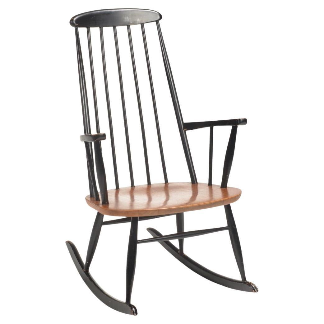 Chaise longue à bascule en teck Roland Rainer