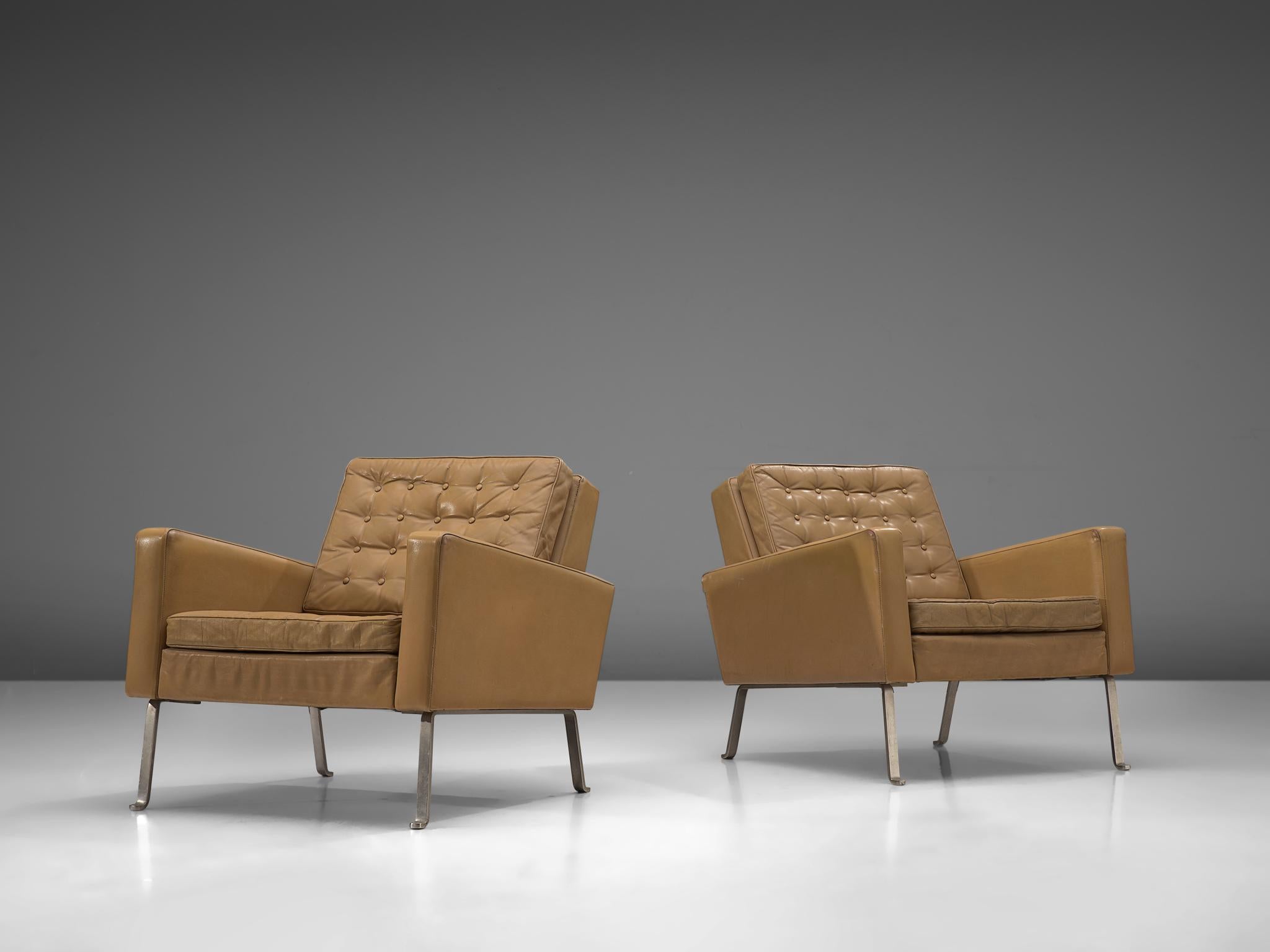 Roland Ranier, pair of lounge chairs, leather, steel, Austria, 1950s

Modern and beautiful armchairs. These chairs form an extraordinary stately set, being both crisp and warm at the same time. The steel frame holds a brown beige leather body with