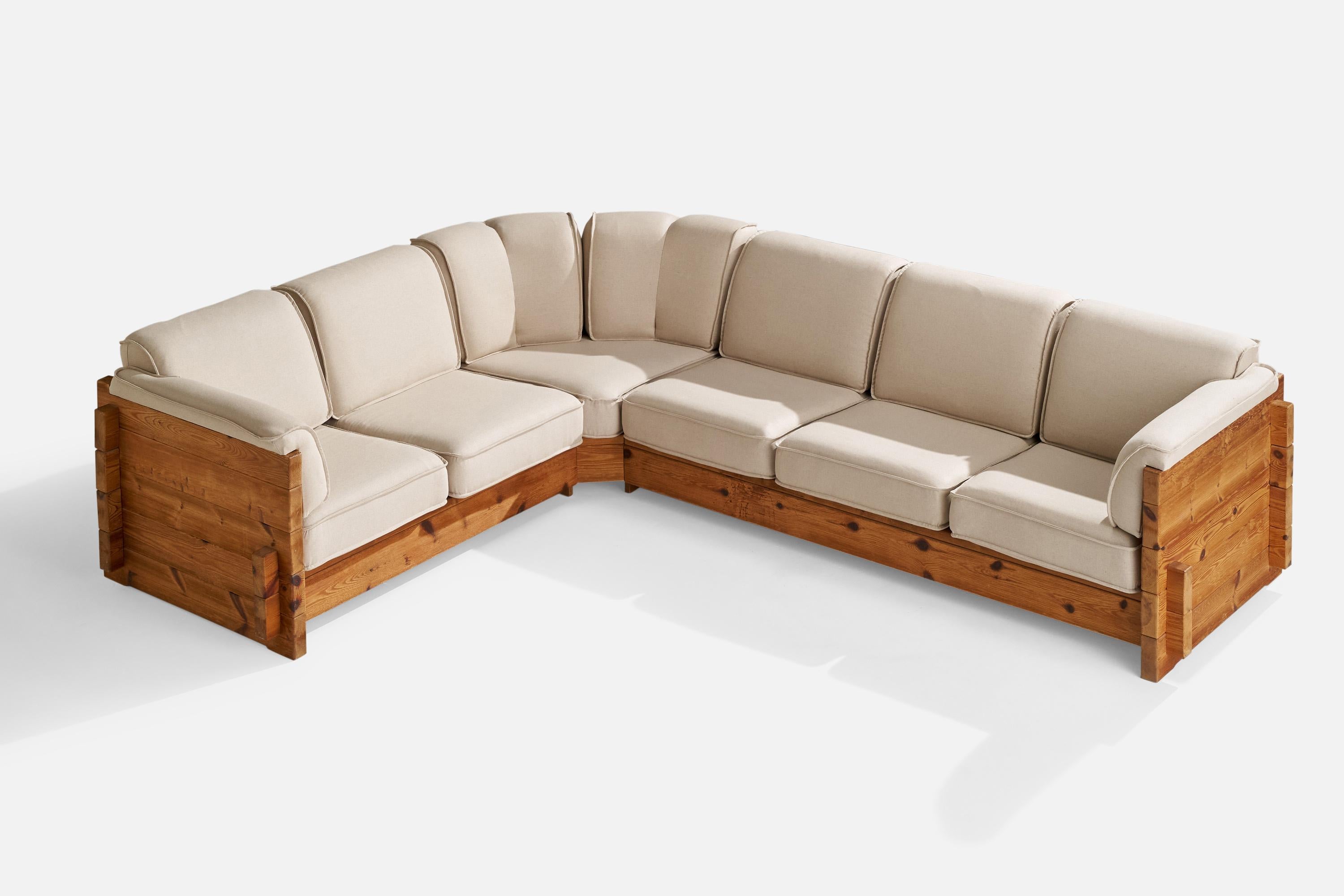 A sizeable sectional pine and off white fabric sofa attributed to Roland Wilhelmsson, Sweden, 1970s.

Seat height 16”.