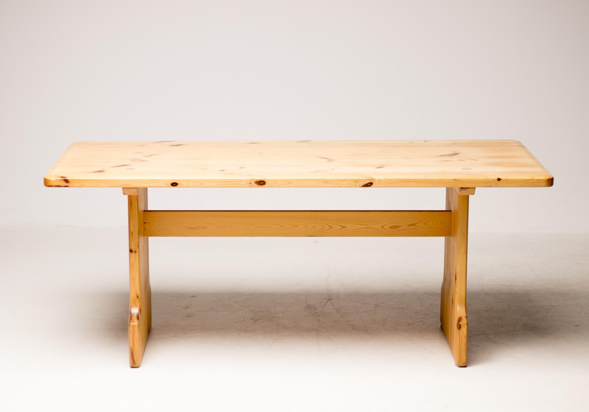 Mid-Century Modern solid pine dining table by Swedish company Karl Andersson and Söner, designed by Roland Wilhelmsson. The matching chairs are available separately.
This remarkable table has sophisticated woodworking details that are also present