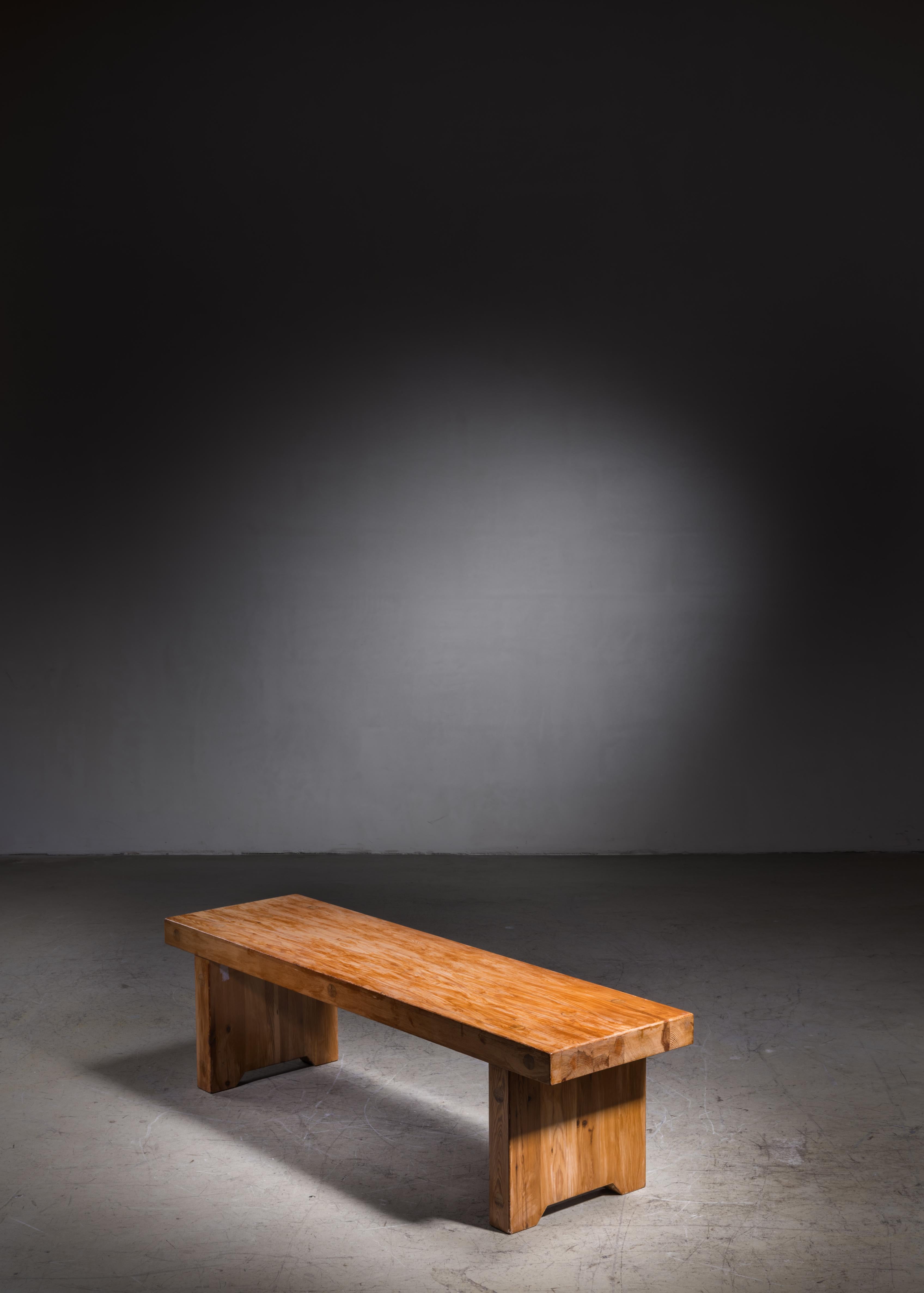 A pine bench or coffee table, attributed to Roland Wilhelmsson. The bench has the large wood connections that Wilhelmsson's work is known for.