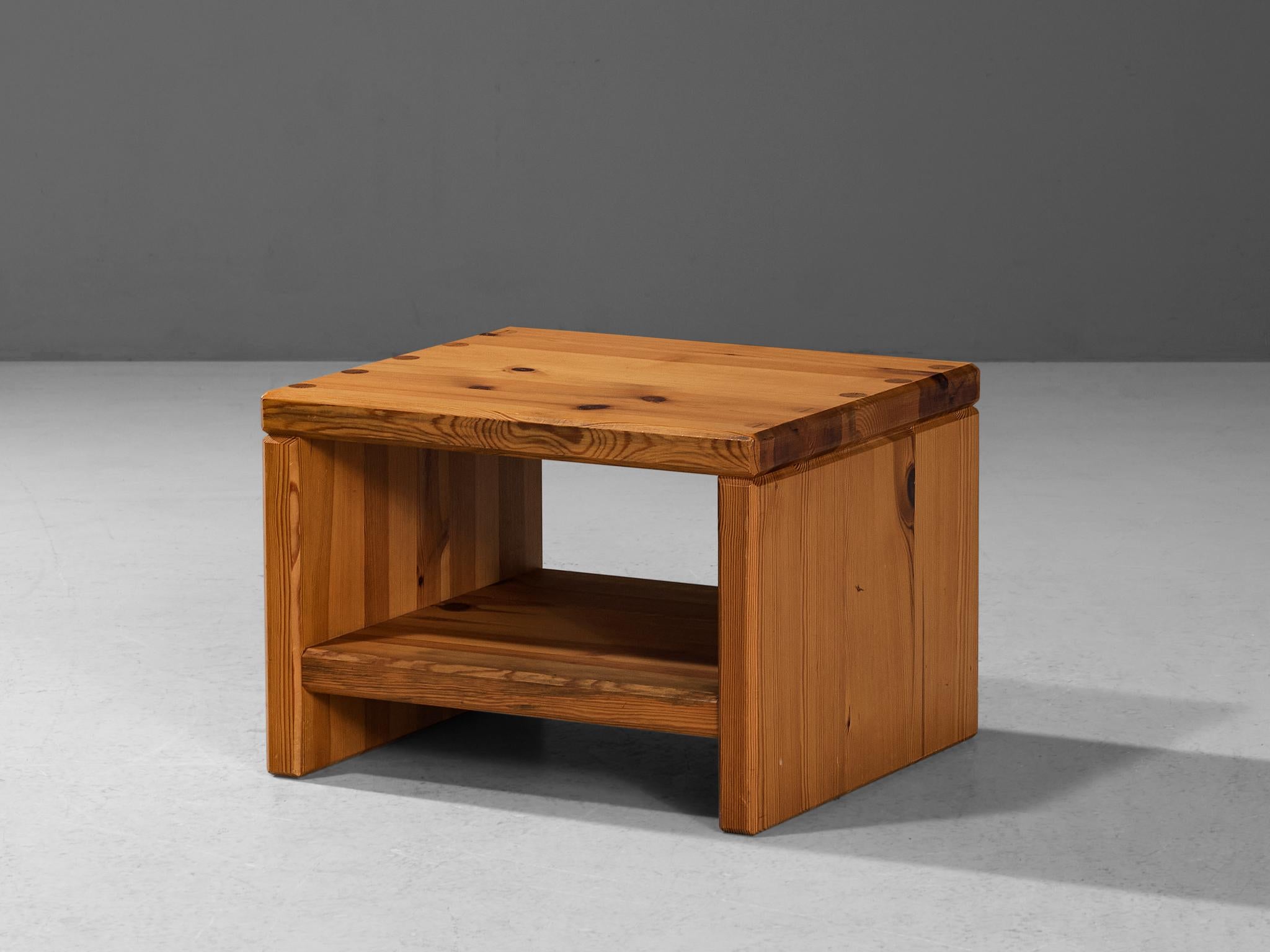 Roland Wilhelmsson for Karl Andersson & Söner, side table, pine, Sweden, 1970s
 
This side table with a solid and sturdy look is constructed in a precise manner implementing straight lines, resulting in a simple and clear furniture piece that is