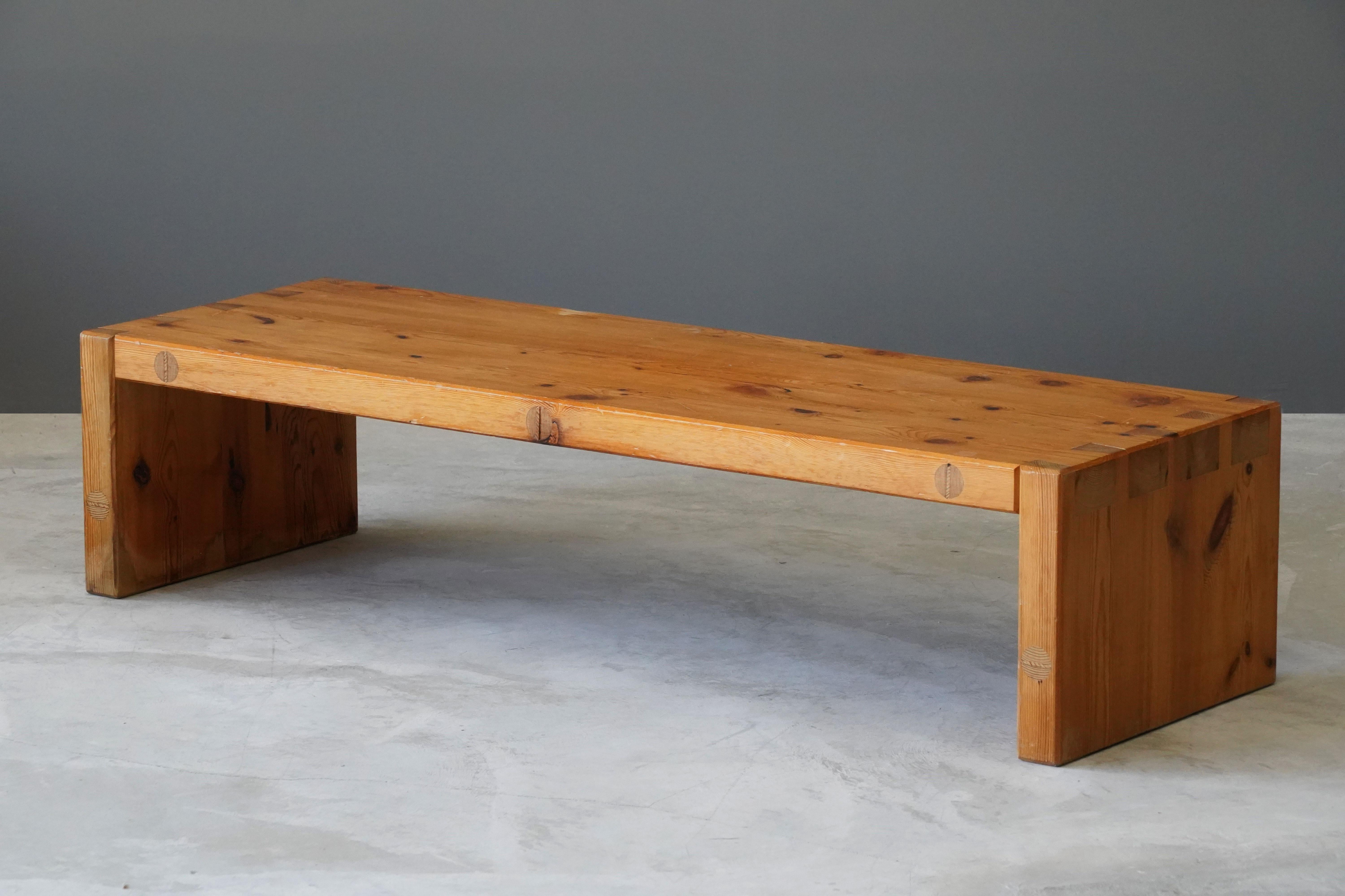 A coffee table or bench, designed and produced by Roland Wilhelmsson in his studio in Ågesta, Sweden. Model 