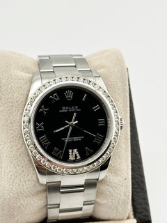 Rolex 114200 34mm Black Roman Dial Diamond Bezel Stainless Steel
