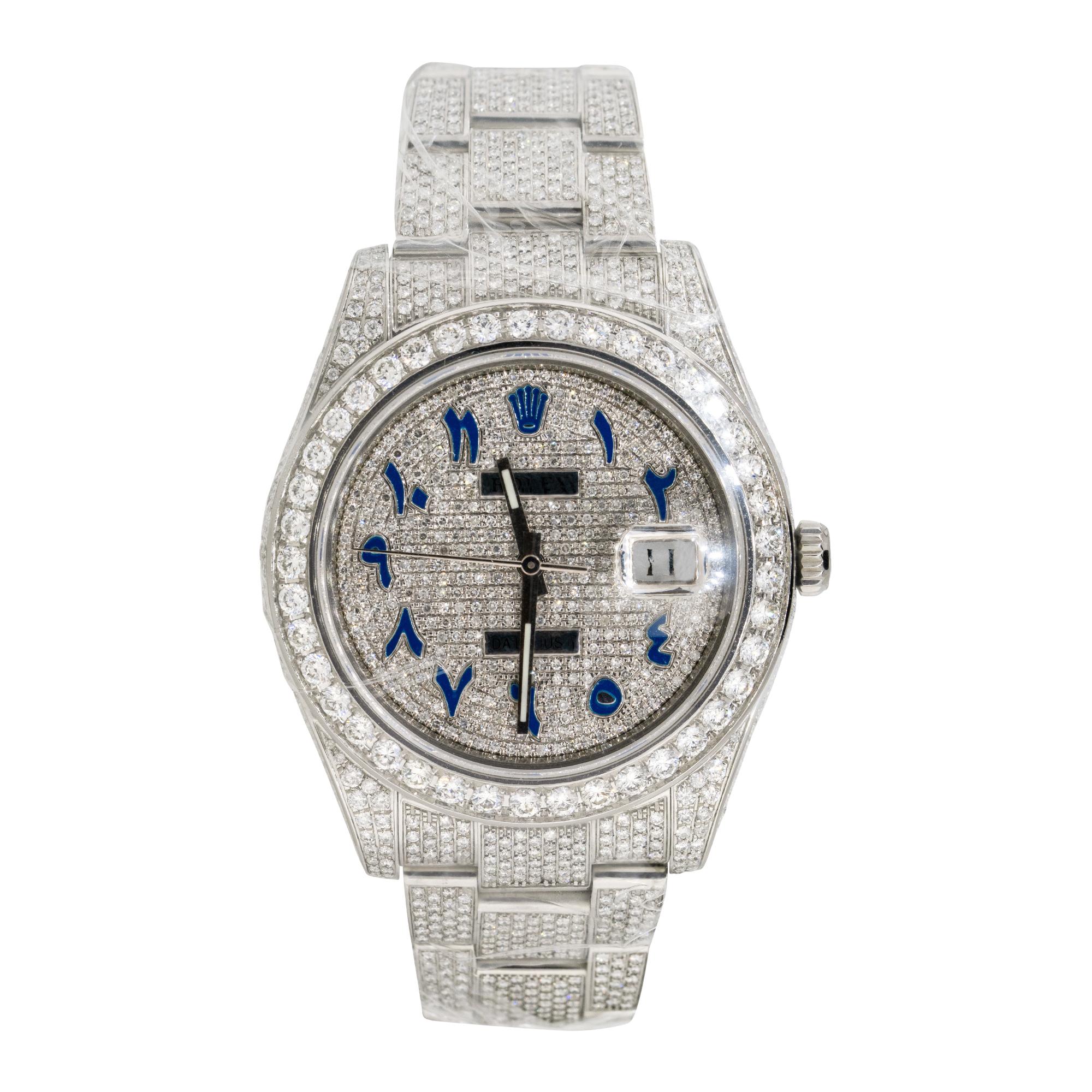 Brand: Rolex
MPN: 116334
Model: Datejust II
Case Material: Stainless steel with aftermarket Diamonds
Case Diameter: 41mm
Crystal: Sapphire Crystal
Bezel: Stainless steel bezel with aftermarket Diamonds
Dial: Dial with blue Arabic numerals covered in