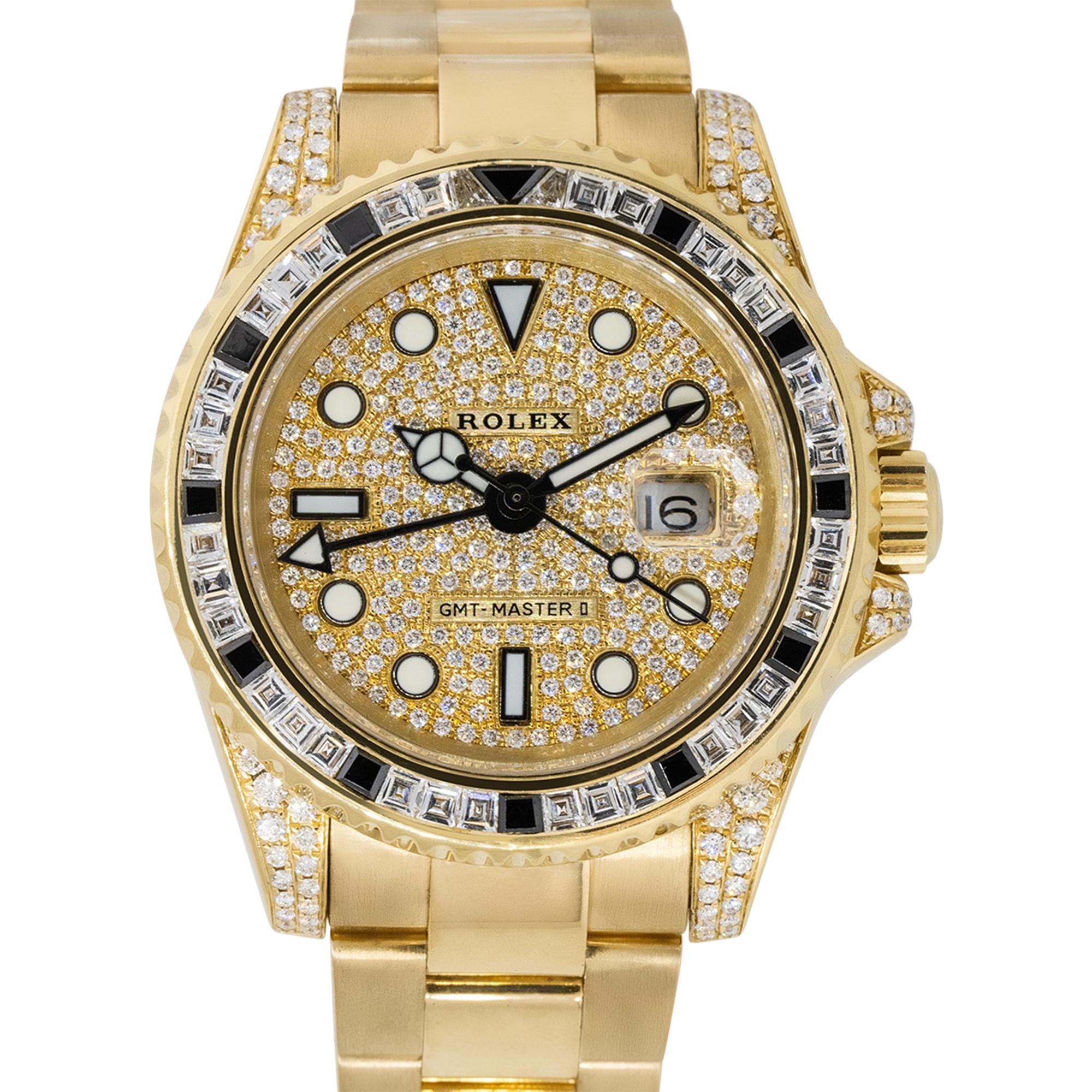 Brand: Rolex
Case Material: 18k Yellow Gold
Case Diameter: 40mm
Crystal: Sapphire Crystal
Bezel: 18k Yellow Gold bezel with Diamonds
Dial: Diamond pave dial with black hands and luminescent hour markers
Bracelet: 18k Yellow Gold Oyster