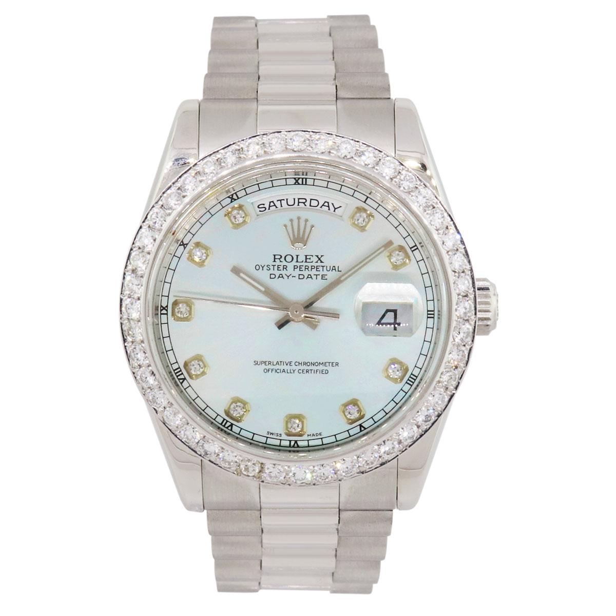 Brand: Rolex
MPN: 118206
Model: Day Date
Case Material: Platinum
Case Diameter: 36mm
Crystal: Sapphire crystal (scratch resistant)
Bezel: Round brilliant diamond bezel (aftermarket)
Dial: Ice blue dial with diamond hour markers