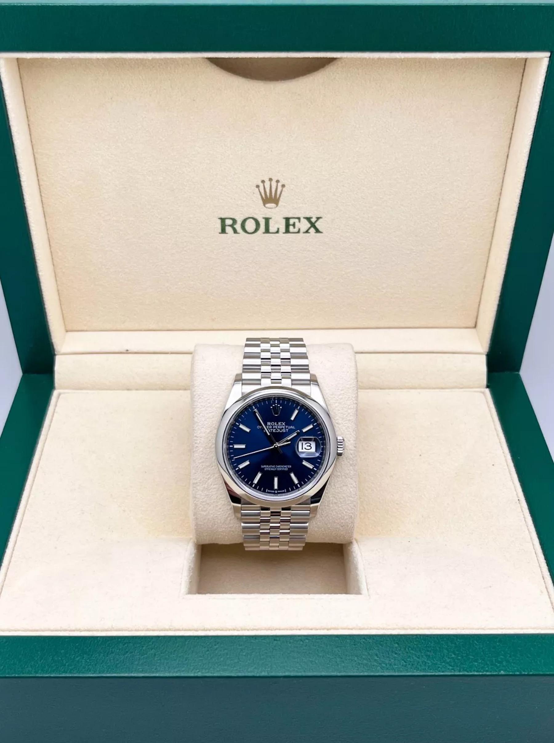 Style Number: 12600
Serial: 242VH***
Year: 2021
Model: Datejust
Case Material: Stainless Steel
Band: Stainless Steel
Bezel: Stainless Steel
Dial: Blue
Face: Sapphire Crystal
Case Size: 36mm

Includes: 
-Rolex Box & Papers
-Certified Appraisal 
-5