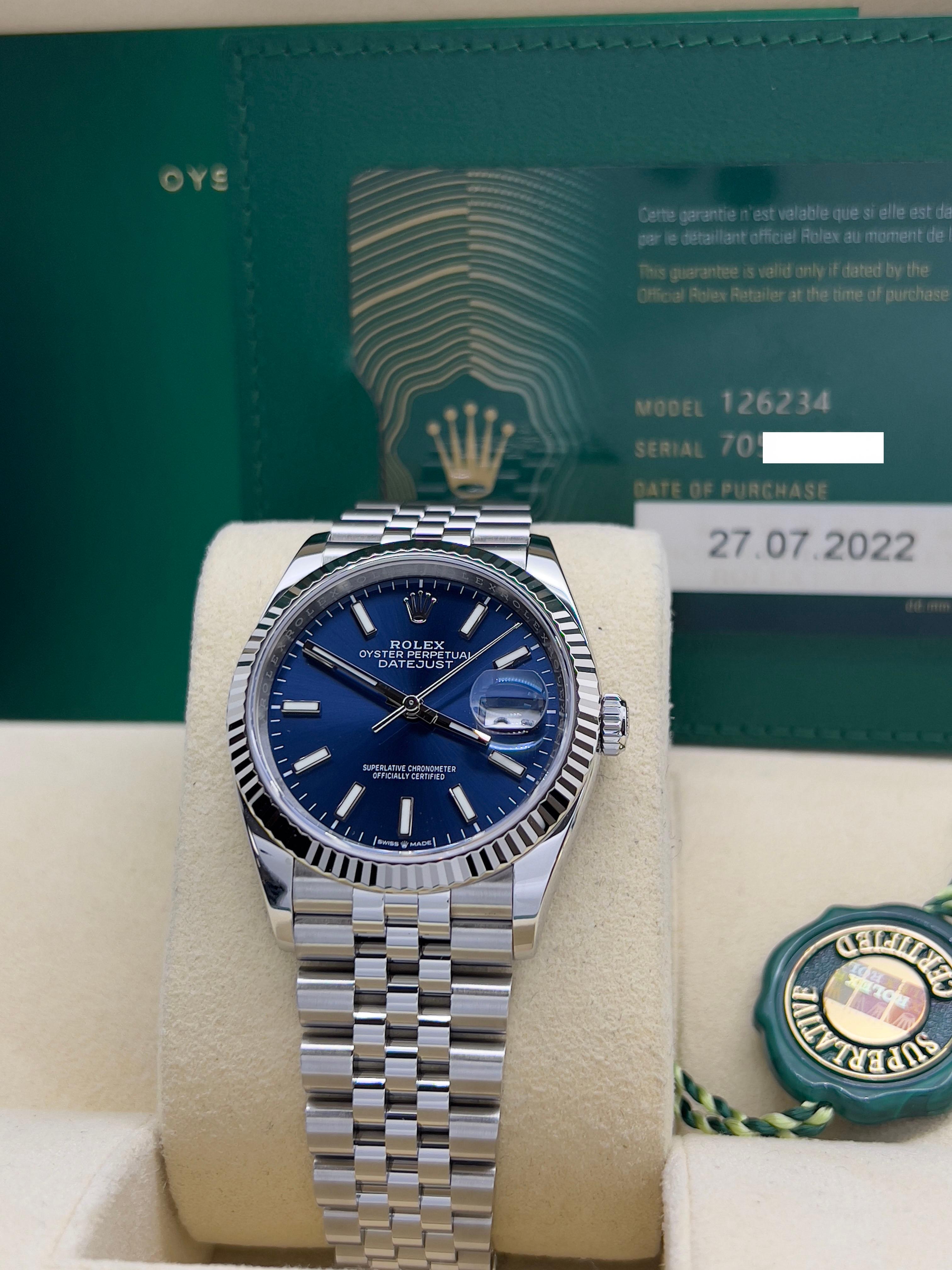 Stilnummer: 126234
Seriennummer: 705VX***
Jahr: 2022
Modell: Rolex Datejust
MATERIAL des Gehäuses: Rostfreier Stahl
Band: Rostfreier Stahl
Lünette: 18K Weißgold geriffelt
Zifferblatt: Blau
Gesicht: Saphirglas
Gehäusegröße: 36mm
Enthält: 
-Rolex Box