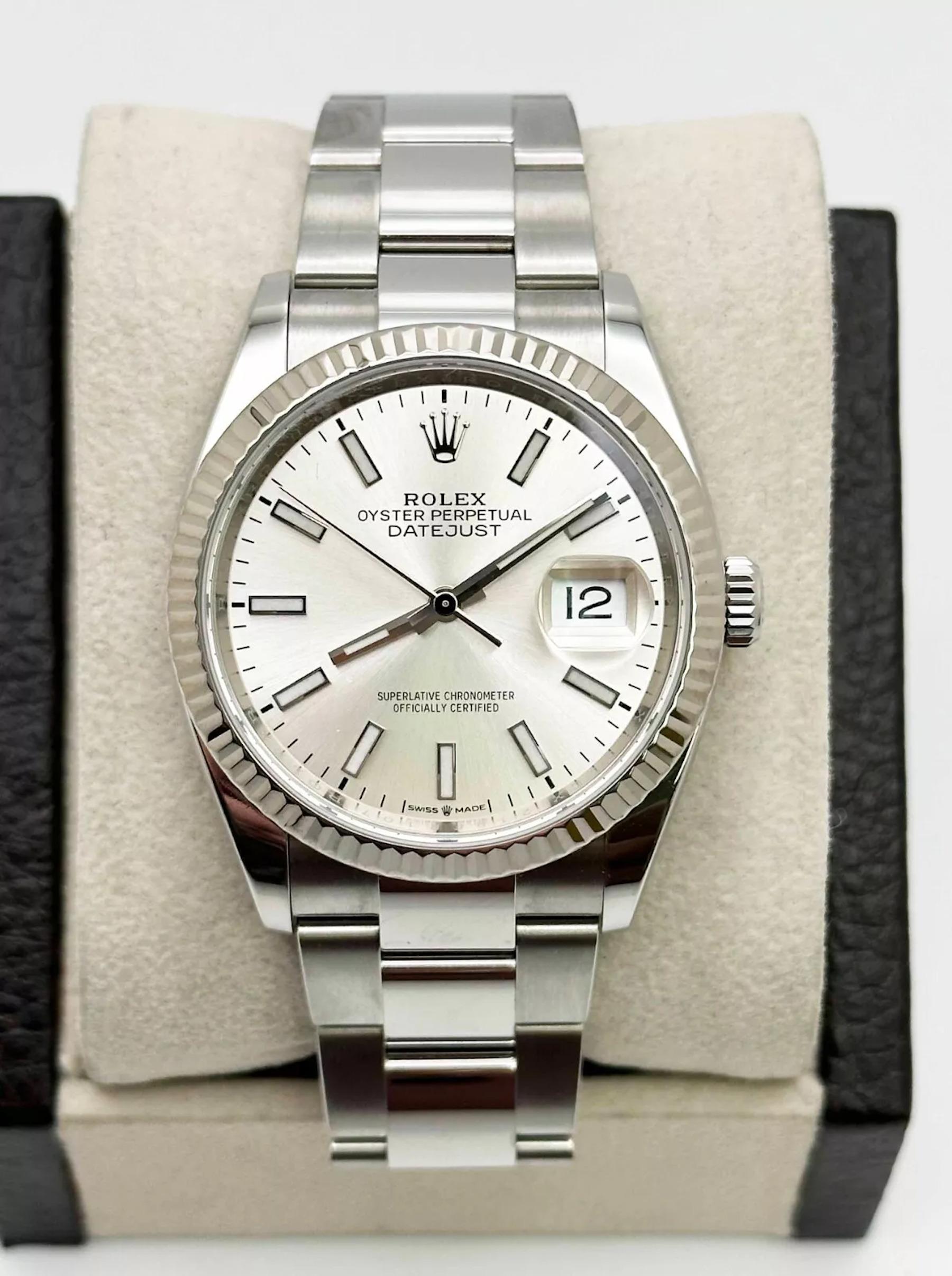 Style Number: 126234
Serial: 218FR***
Model: Rolex Datejust
Case Material: Stainless Steel
Band: Stainless Steel
Bezel: 18K White Gold Fluted
Dial: Silver
Face: Sapphire Crystal
Case Size: 36mm
 Includes: 
-Elegant Watch Box
-Certified Appraisal 
-1