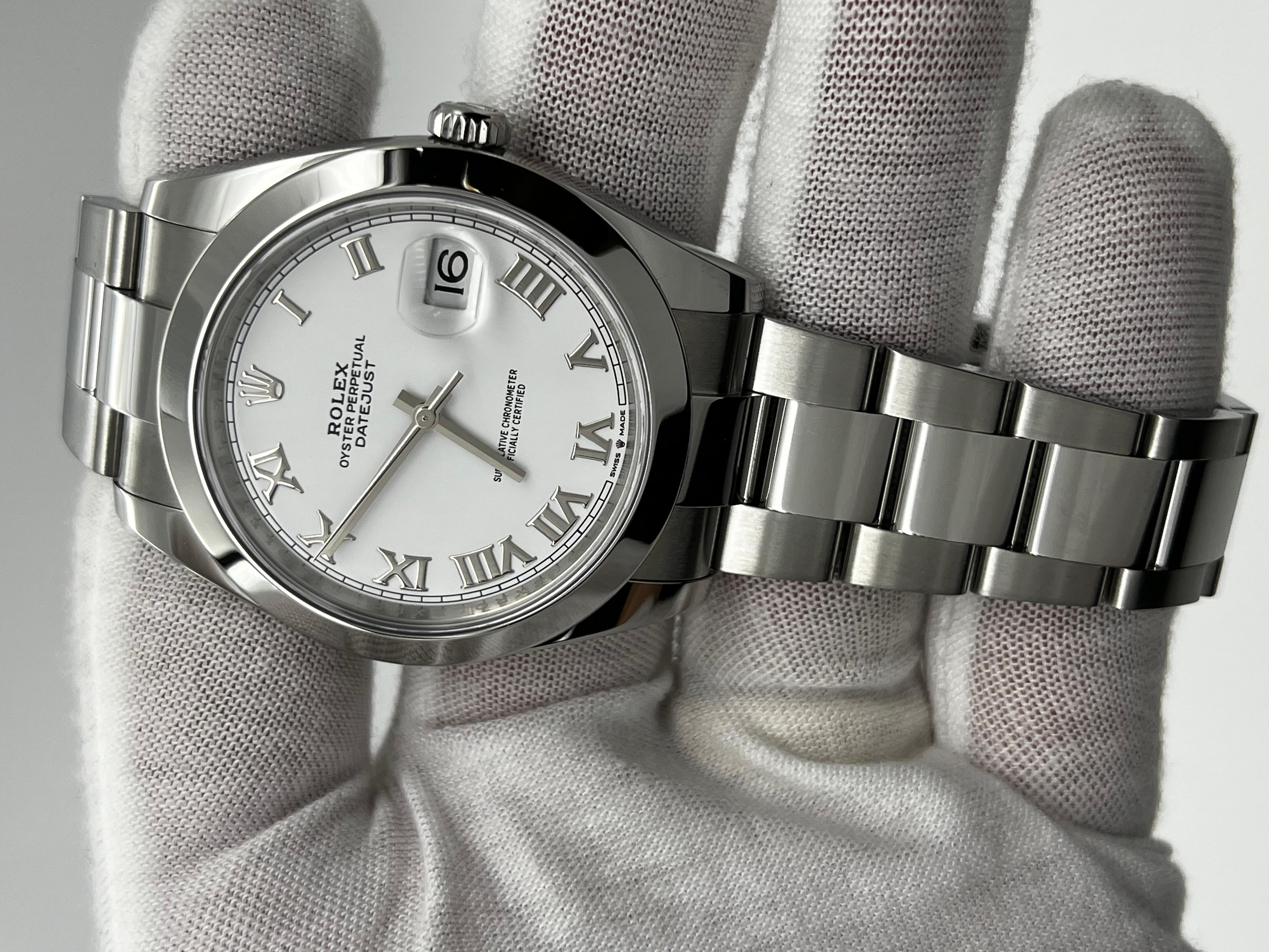 Stilnummer: 126300



Seriennummer: 8G179***



Jahr: 2021

 

Modell: Datejust 41

 

MATERIAL des Gehäuses: Rostfreier Stahl

 

Band: Rostfreier Stahl

 

Lünette: Edelstahl

 

Zifferblatt: Weißes römisches Zifferblatt

 

Gesicht: Saphirglas

