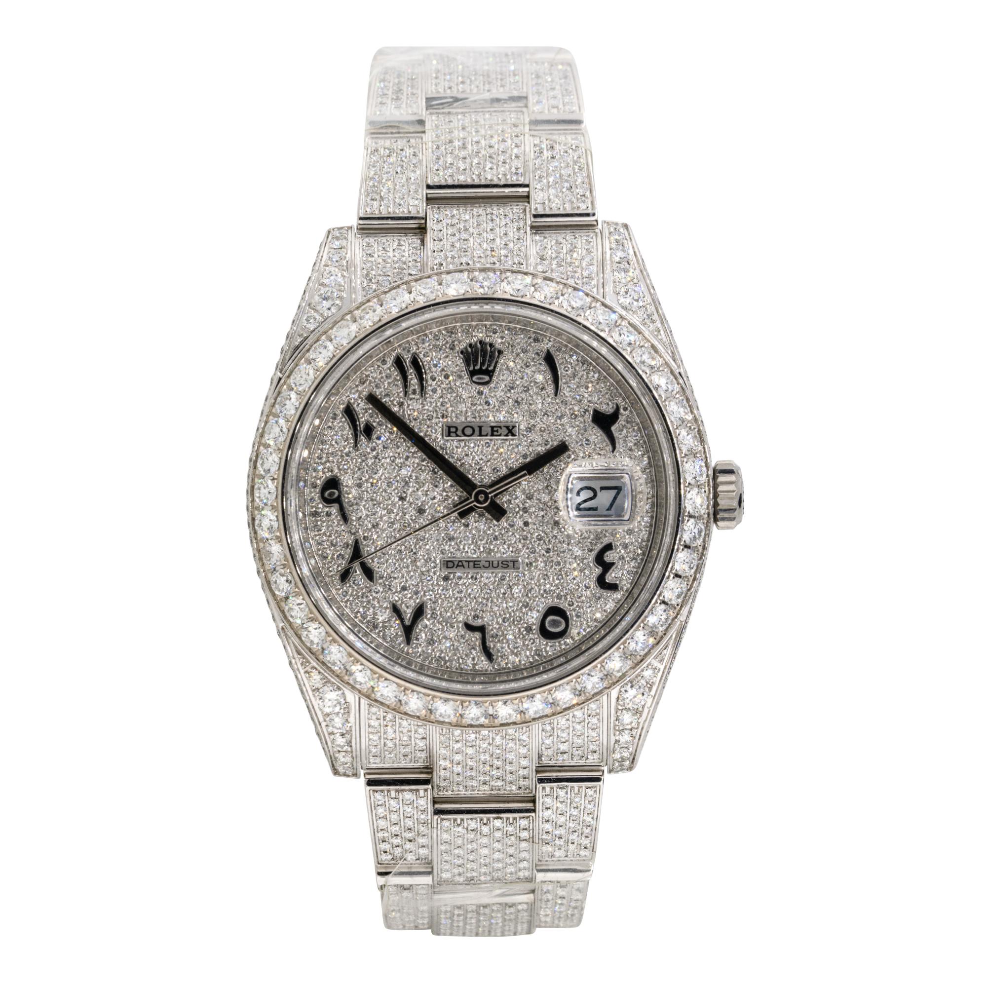 Brand: Rolex
MPN: 126300
Model: Datejust II
Case Material: Stainless steel with aftermarket Diamonds
Case Diameter: 41mm
Crystal: Sapphire Crystal
Bezel: Stainless steel bezel with aftermarket Diamonds
Dial: Dial with black Arabic numerals covered