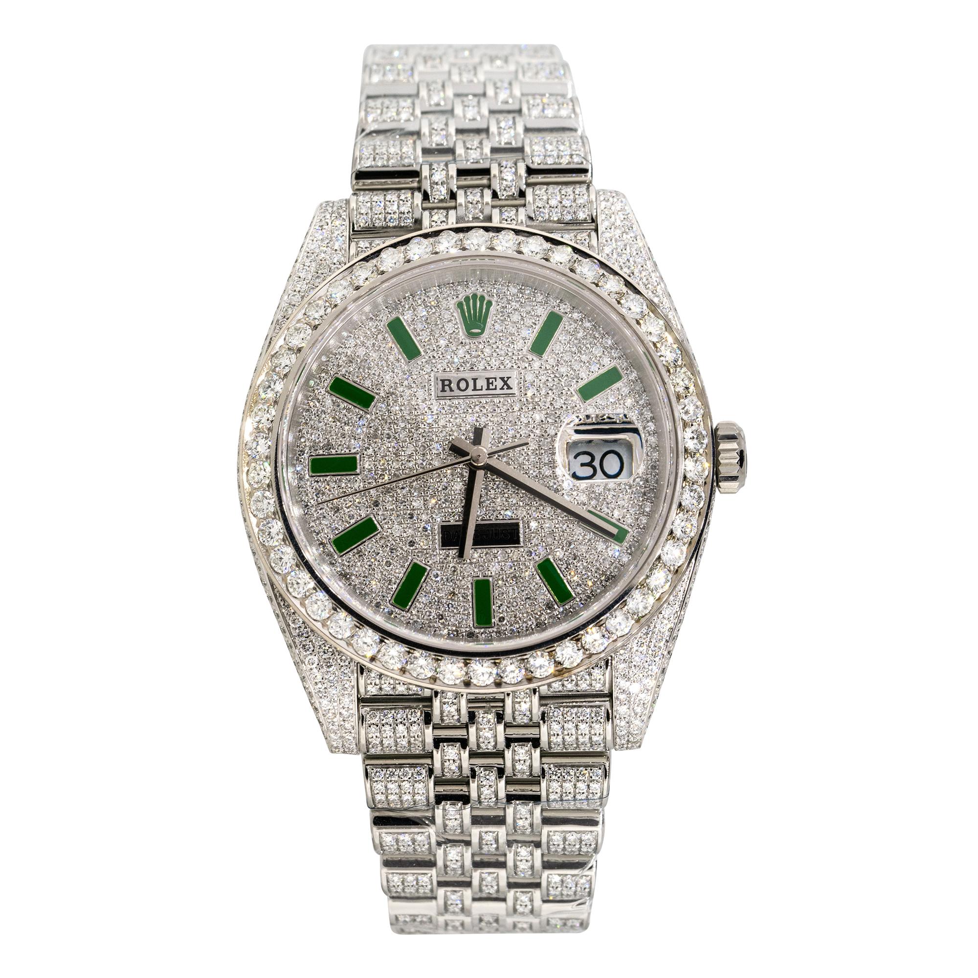 Brand: Rolex
MPN: 126300
Model: Datejust II
Case Material: Stainless steel with aftermarket Diamonds
Case Diameter: 41mm
Crystal: Sapphire Crystal
Bezel: Stainless steel bezel with aftermarket Diamonds
Dial: Dial with green hour markers, covered in