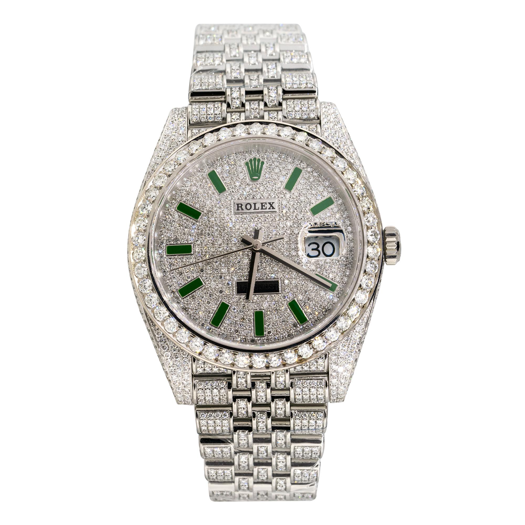 The Rolex 126300 Datejust II All Diamond Green Marker Dial Watch is a luxurious and eye-catching timepiece known for its opulent design. 
Brand: Rolex
MPN: 126300
Model: Datejust II
Case Material: Stainless steel with aftermarket Diamonds
Case