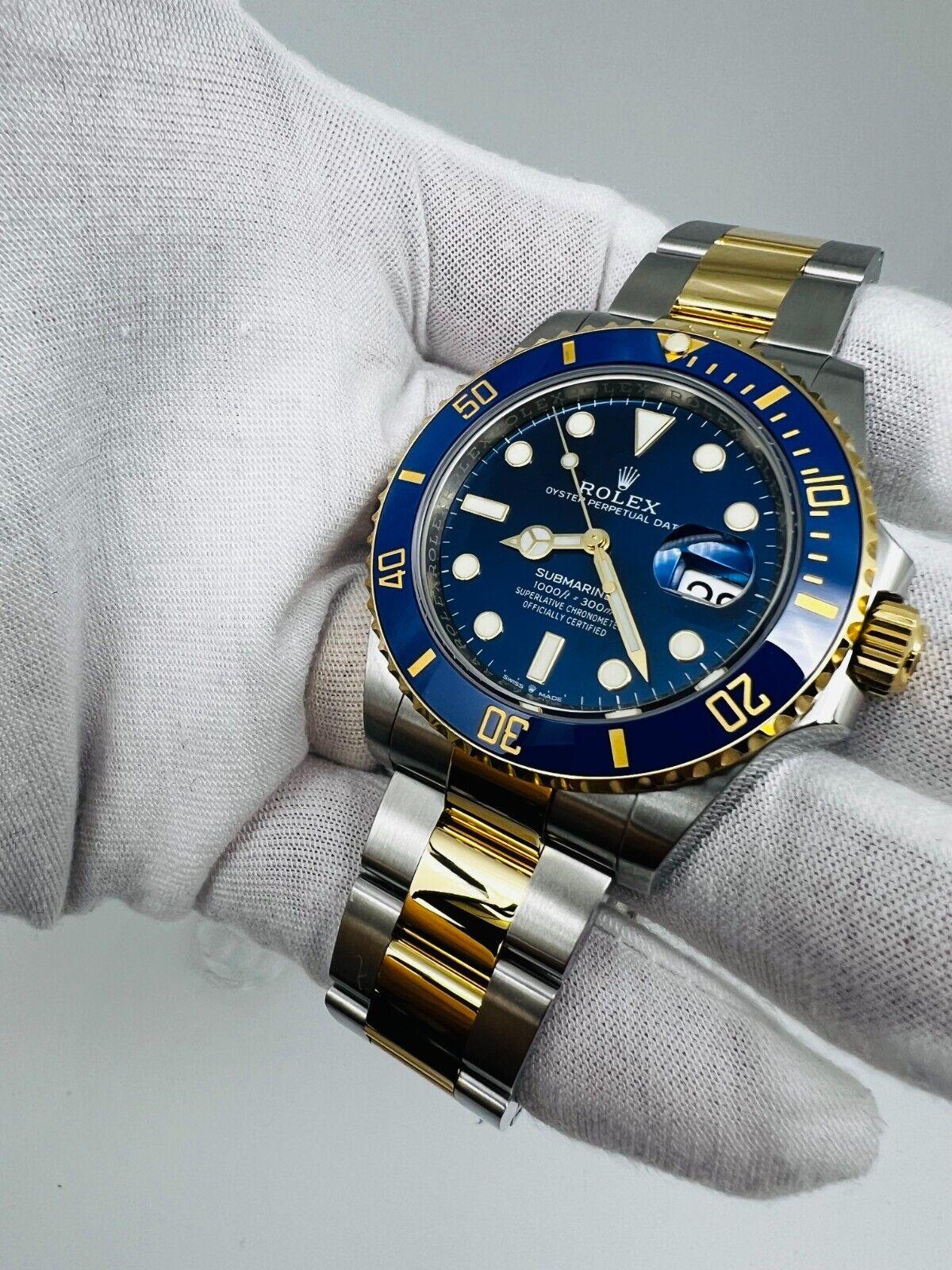 Style Number: 126613

Serial: OVC91***

Year: 2022
 
Model: Submariner
 
Case Material: Stainless Steel 
 
Band: 18K Yellow Gold & Stainless Steel 
 
Bezel: Blue Ceramic 
 
Dial: Blue Dial 
 
Face: Sapphire Crystal 
 
Case Size: 41mm 
 
Includes:
