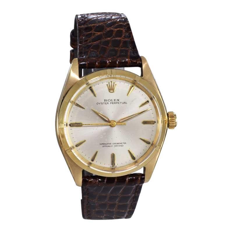 FACTORY / HOUSE: Rolex Watch Company
STYLE / REFERENCE: Oyster Perpetual / Reference 1003
METAL / MATERIAL: 14kt. Solid Gold 
CIRCA / YEAR: 1962
DIMENSIONS / SIZE: 39mm x 35mm 
MOVEMENT / CALIBER: Perpetual Winding / 26 Jewels 
DIAL / HANDS: