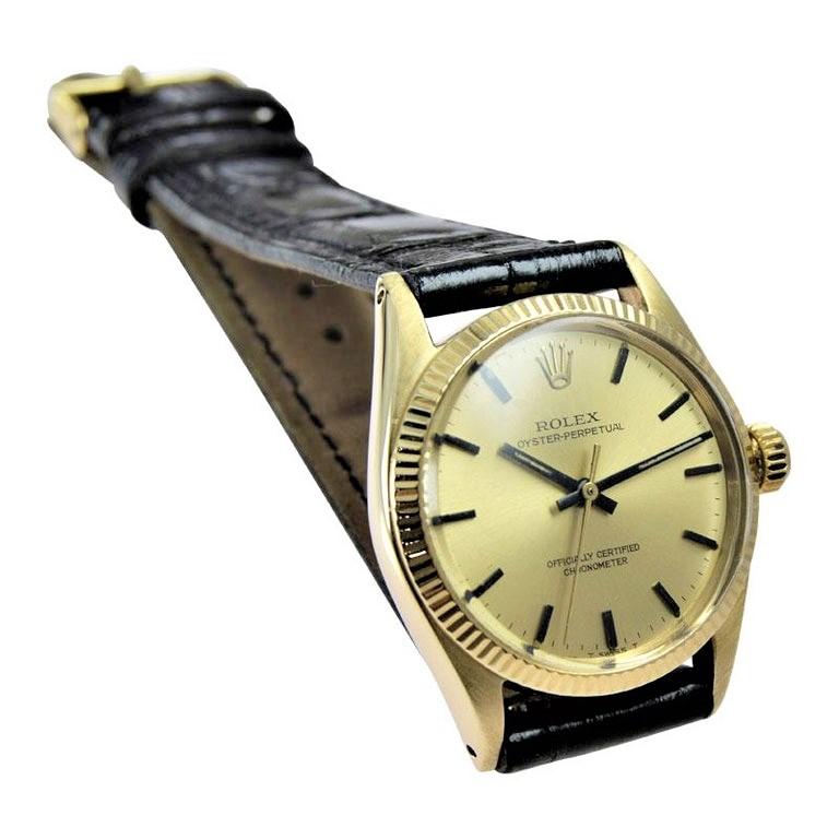 FACTORY / HOUSE: Rolex Watch Company
STYLE / REFERENCE: Oyster Perpetual / Reference 6551
METAL / MATERIAL: 14Kt. Solid Gold
CIRCA / YEAR: 1965 or 66
DIMENSIONS / SIZE: Length 33mm X Diameter 27mm
MOVEMENT: Perpetual Winding / 26 Jewels / Caliber
