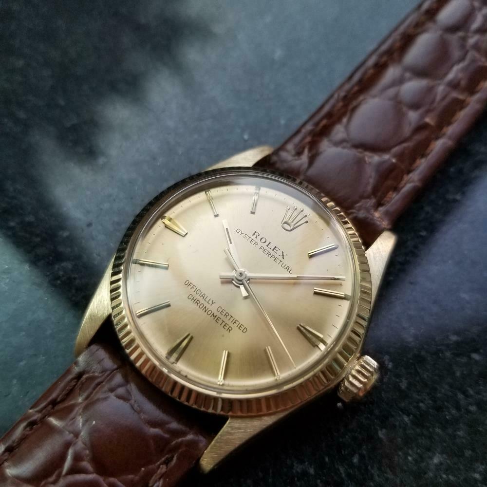 Luxurious icon, midsize 14K solid gold Rolex Oyster Perpetual ref.6551 automatic, c.1966. Verified authentic by a master watchmaker. Gorgeous vintage gold Rolex signed dial, applied gold baton hour markers, gold minute and hour hands, sweeping