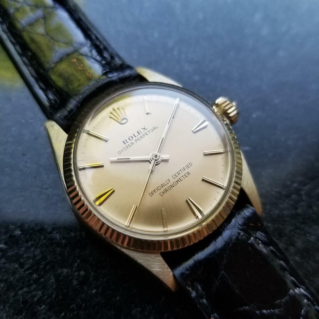 Luxurious icon, Unisex 14K solid gold Rolex Oyster Perpetual 6551 midsize automatic, c.1966, original. Verified authentic by a master watchmaker. Gorgeous Rolex gold dial, applied gold baton hour markers, gold minute and hour hands, sweeping central