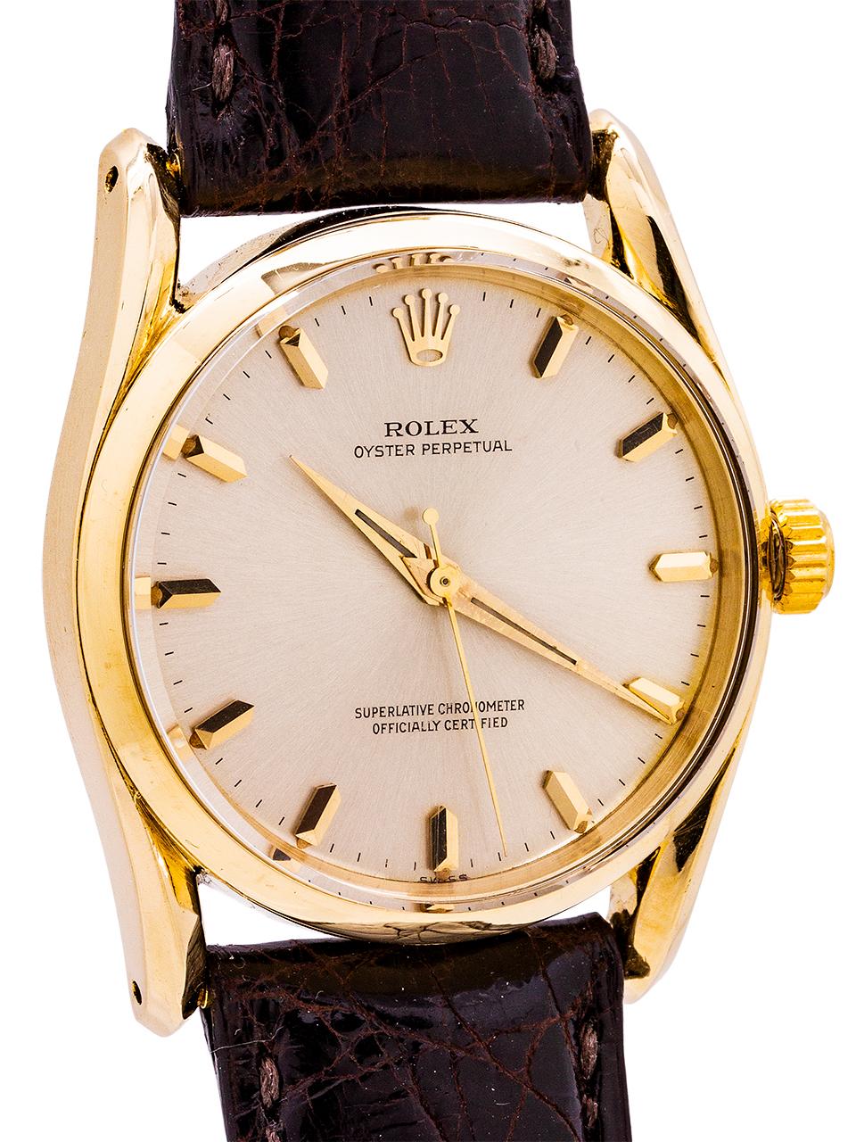 
Rolex Oyster Perpetual so called  “Bombe” model 14K gold ref # 1010 serial# 529,xxx circa 1960. Featuring a 34mm Oyster case with bowed lugs, smooth bezel, acrylic dome style crystal, and beautiful  condition original matte silver dial with applied