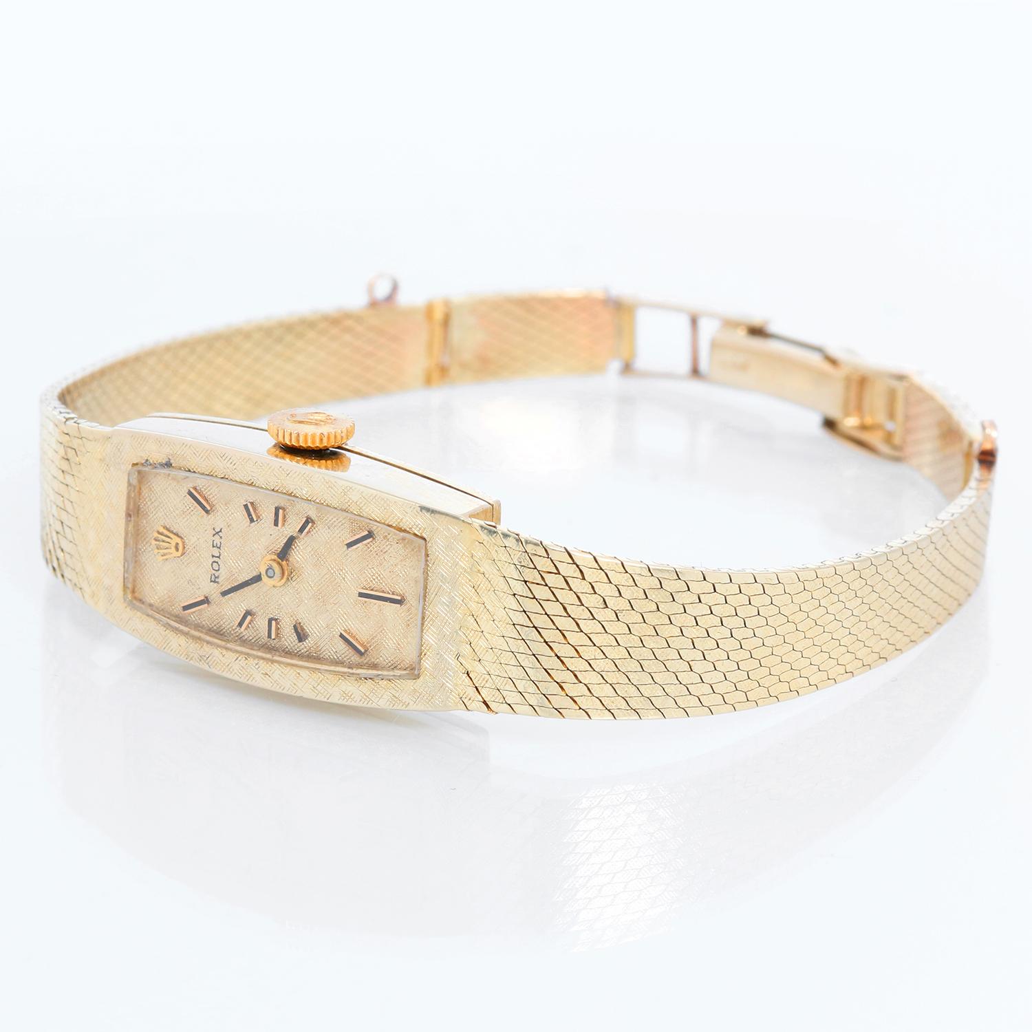 Rolex 14K Yellow Gold Manual Ladies Watch - Manual winding. 14K Yellow gold ( 13 x 23 mm ) Will have engraving removed. Textured champagne dial with stick hour markers. 14K yellow gold mesh bracelet; will fit up to a 6 inch wrist. Pre-owned with