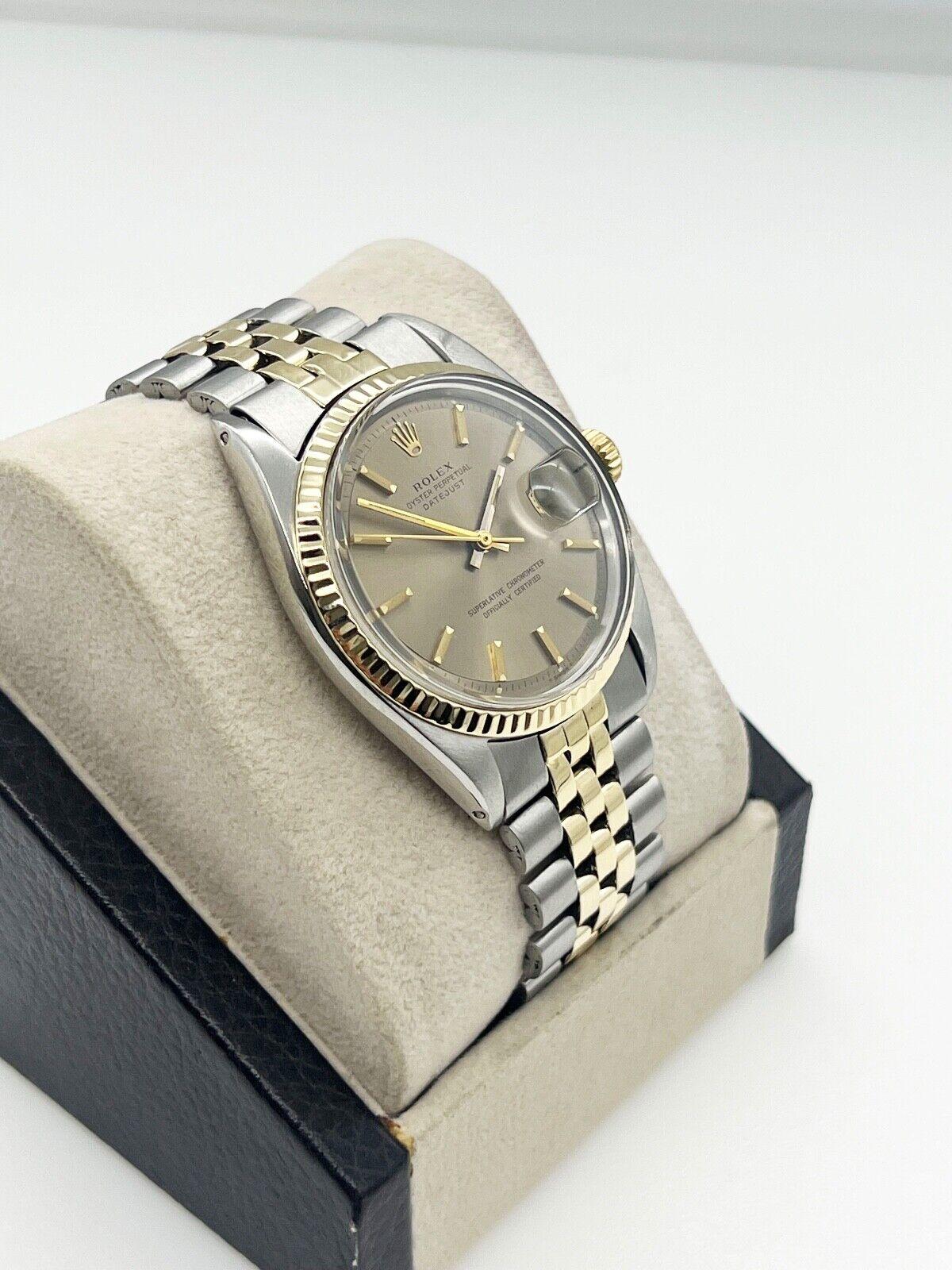 Style Number: 1601

Serial: 2657***

Year: 1970

Model: Datejust

Case Material: Stainless Steel

Band: 14K Yellow Gold & Stainless Steel 

Bezel: 14K Yellow Gold 

Dial: Brown Pie Pan Dial

Face: Acrylic 

Case Size: 36mm

Includes: 

-Elegant