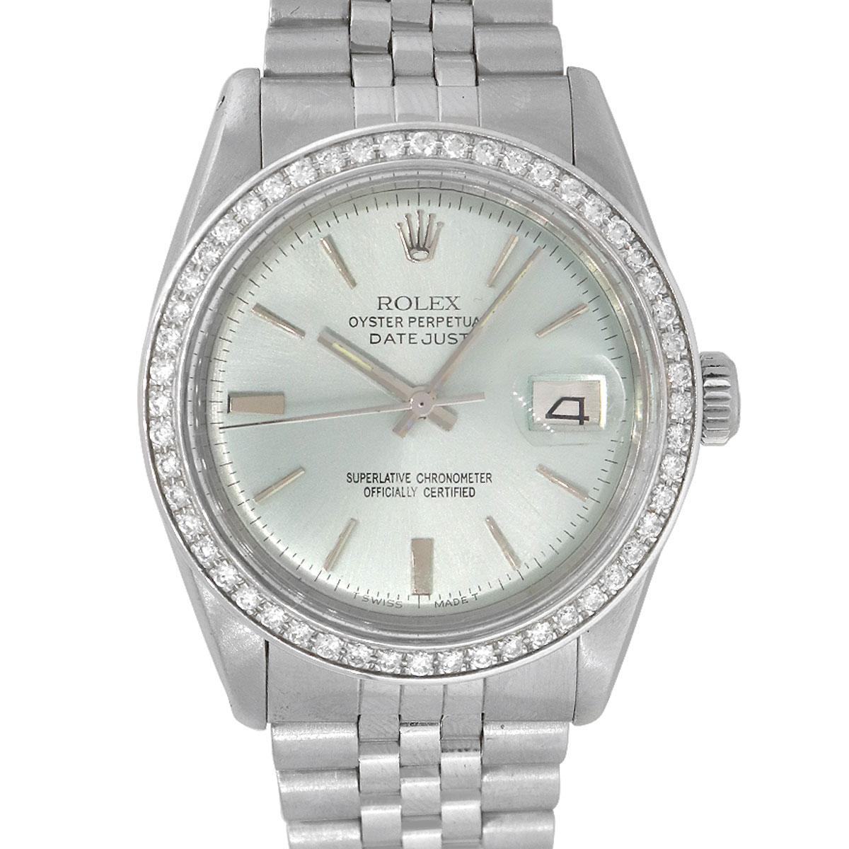 Brand: Rolex
MPN: 1601
Model: Datejust
Case Material: Stainless steel
Case Diameter: 36mm
Crystal: Plastic
Bezel: Aftermarket Diamond bezel
Dial: Teal dial with silver stick hour markers and silver hands. Date can be found at 3 o'clock
Bracelet: