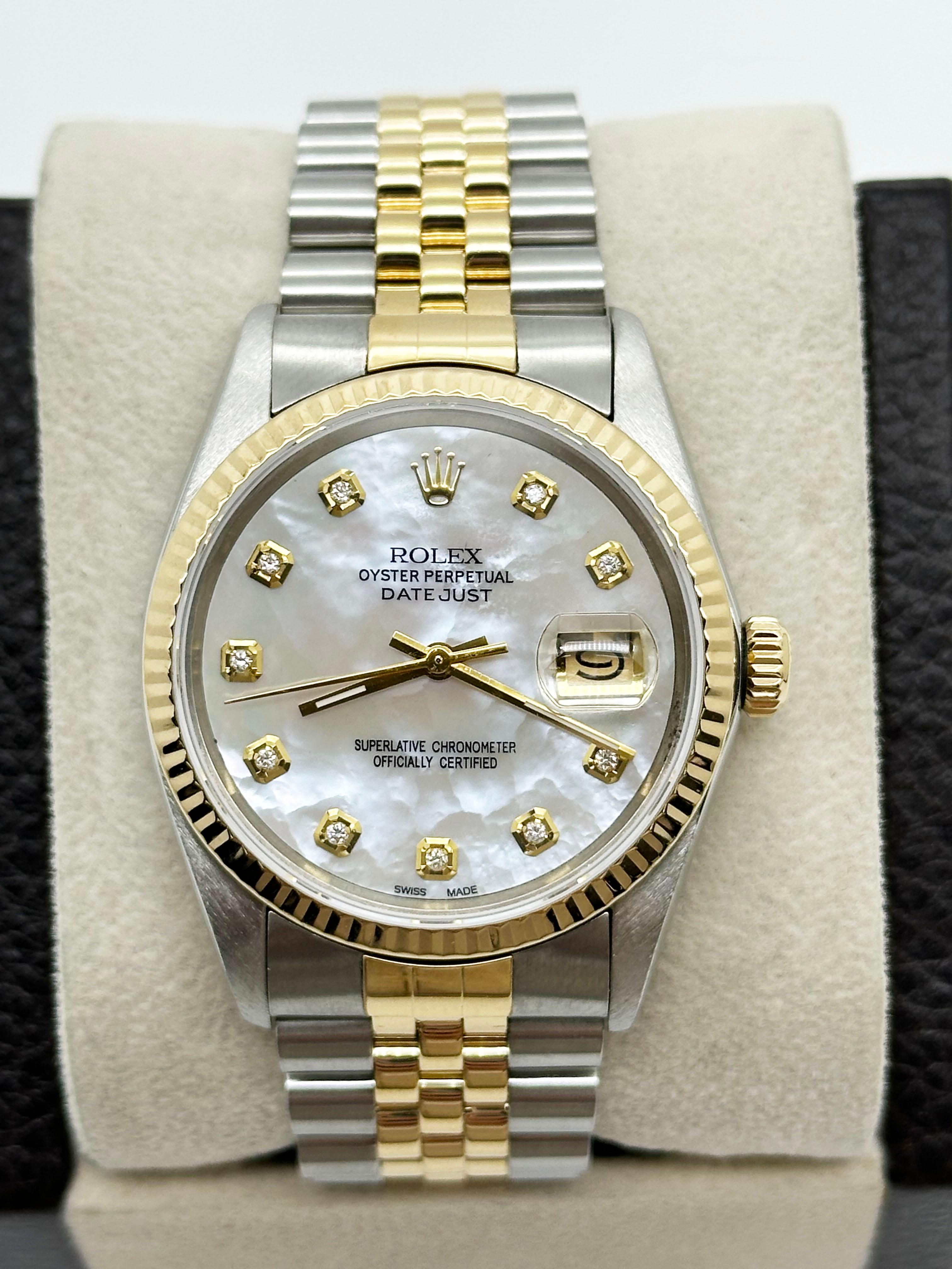 Style Number: 16013
Serial: 9167***
Year: 1986
Model: Datejust 
Case Material: Stainless Steel
Band: 18K Yellow Gold & Stainless Steel 
Bezel: 18K Yellow Gold 
Dial: Custom White Mother of Pearl Diamond Dial 
Face: Sapphire Crystal 
Case Size: 36mm