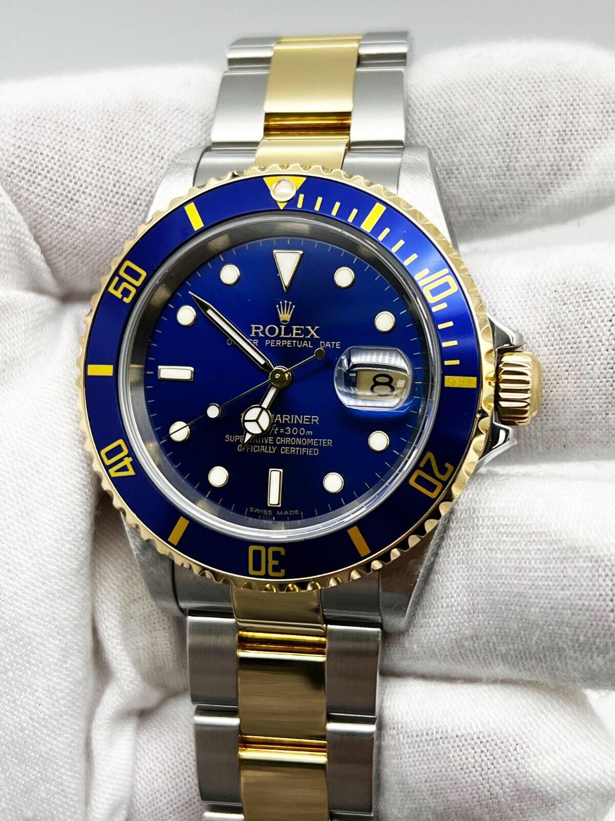 Style Number: 16613

Serial: D571***

Year: 2006
 
Model: Submariner 
 
Case Material: Stainless Steel 
 
Band: 18K Yellow Gold & Stainless Steel 
 
Bezel: Blue 
 
Dial: Blue 
 
Face: Sapphire Crystal 
 
Case Size: 40mm
 
Includes: 
-Rolex Box &