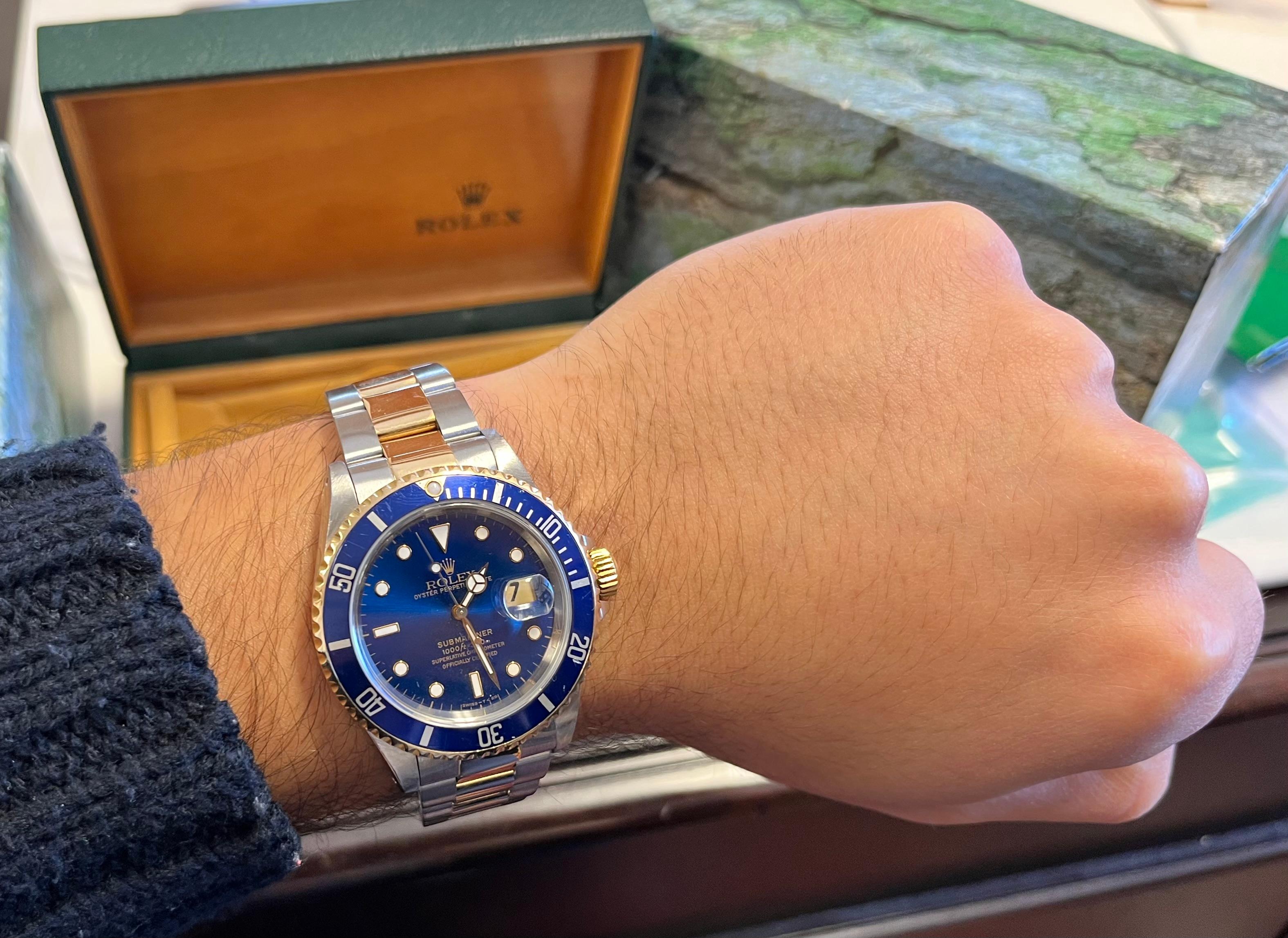 Rolex Blue Face Submariner Ref. 16613 in two-tone Rolex Oyster band. This Rolex Submariner has an adjustable clasp closure, allowing for a comfortable fit on the wrist from sizes 7 to 8.5 inches. Complete with original Submariner box. We priced this