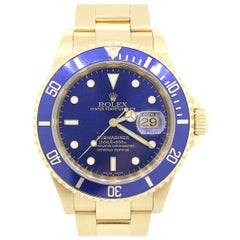 Montre Rolex 16618 Submariner à cadran et lunette bleus