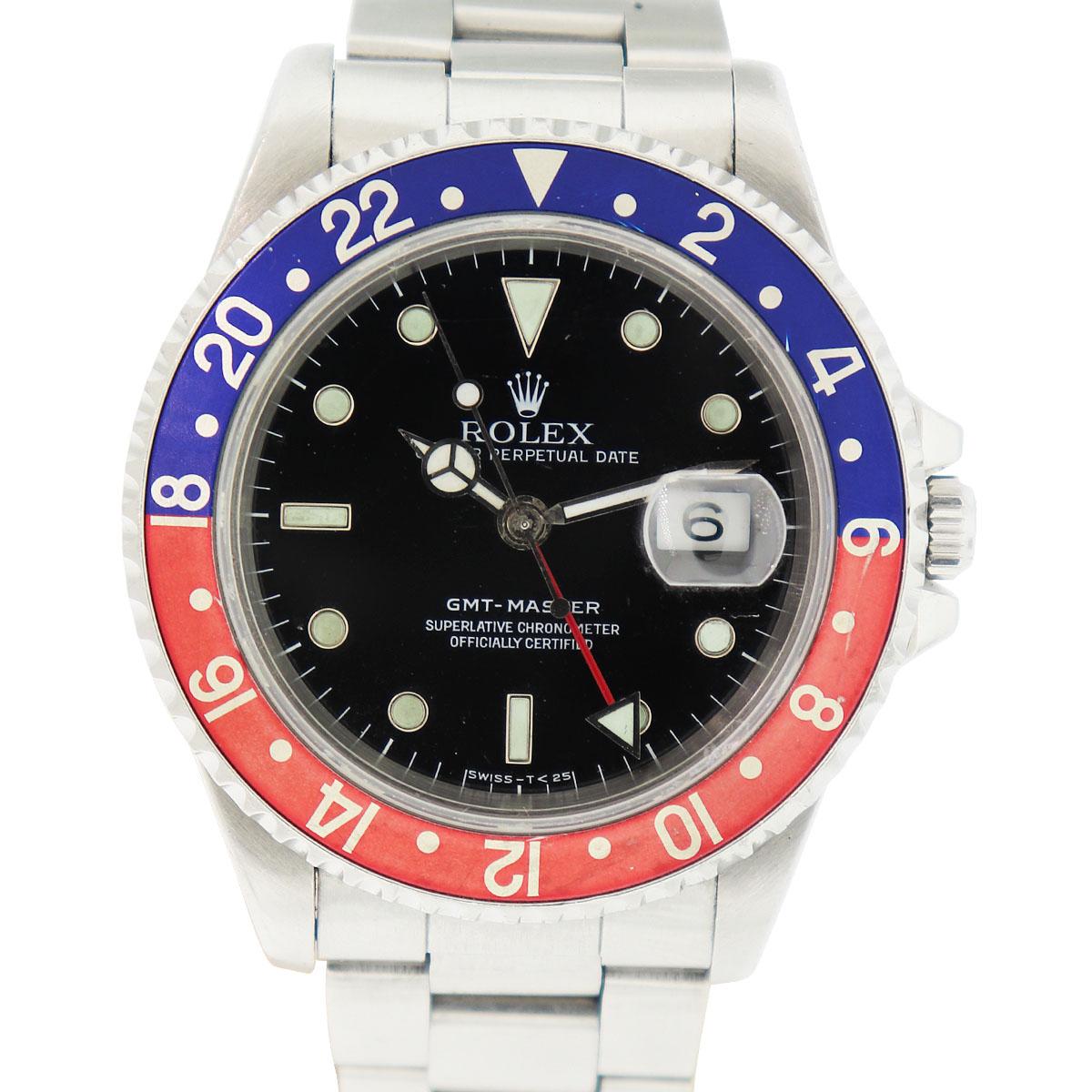 Elevate your wrist game with the iconic Rolex 16700 GMT Master 'Pepsi.' This stainless steel masterpiece features a striking black dial with silver hands, while the signature red and blue bezel sets it apart. With precise automatic movement and a