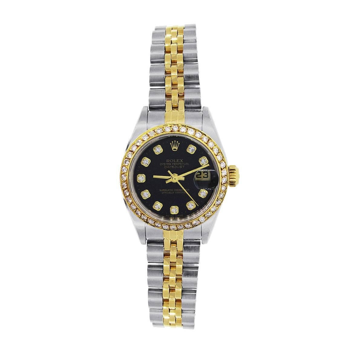 Brand: Rolex
Model: Datejust
MPN: 179173
Serial: “P”
Dial: Black Dial with Diamond markers, Date located at 3’o clock.
Case Measurements: 26mm
Bezel Details: 18k Yellow gold Diamond Fixed Bezel
Bracelet: Two Tone jubilee band
Clasp: Fold over