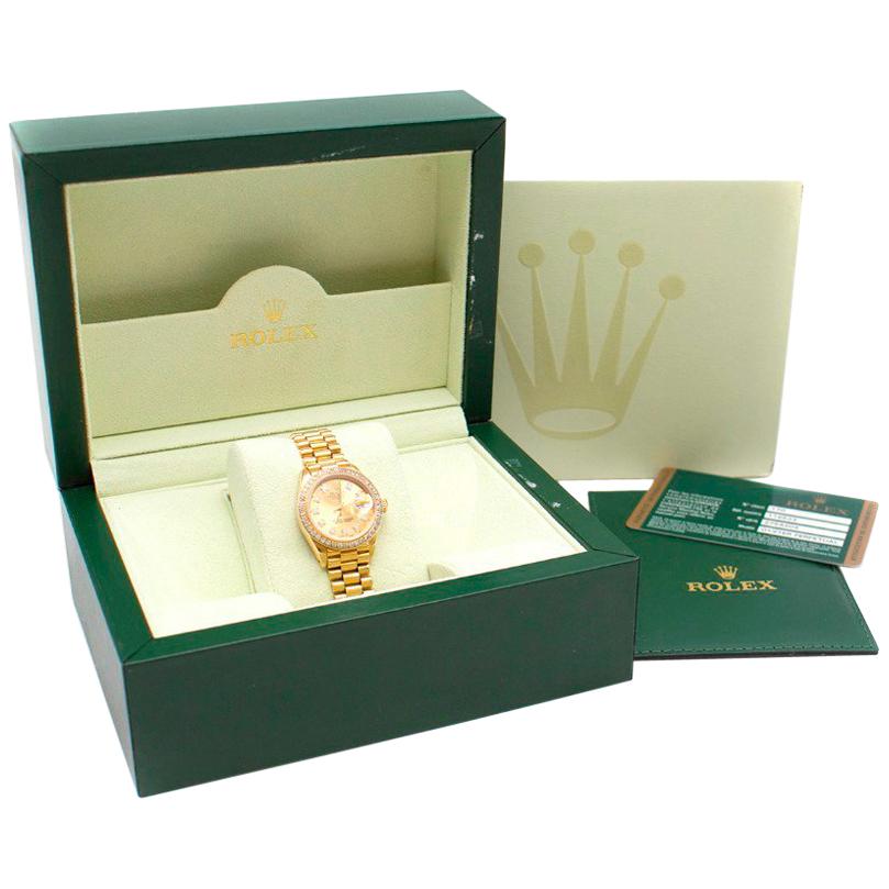 Rolex Oyster 28mm Yellow Gold and White Diamond Lady DateJust Watch 

Pre-1999

- Watch name: DateJust
- Oyster Architecture: Monobloc middle case, screw-down case back and winding crown
- 18k Yellow Gold with 28mm Diameter Diamond bezel 
-