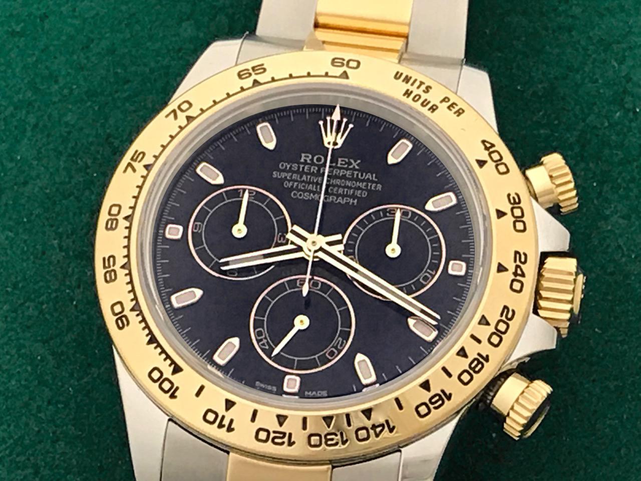 Rolex Men's Daytona Model 116503 at a great price.  Automatic Winding Oyster Perpetual Cosmograph, black dial with luminous gold hour markers.  Stainless steel case with 18k yellow gold bezel, Stainless Steel and 18k Yellow Gold Oyster bracelet with