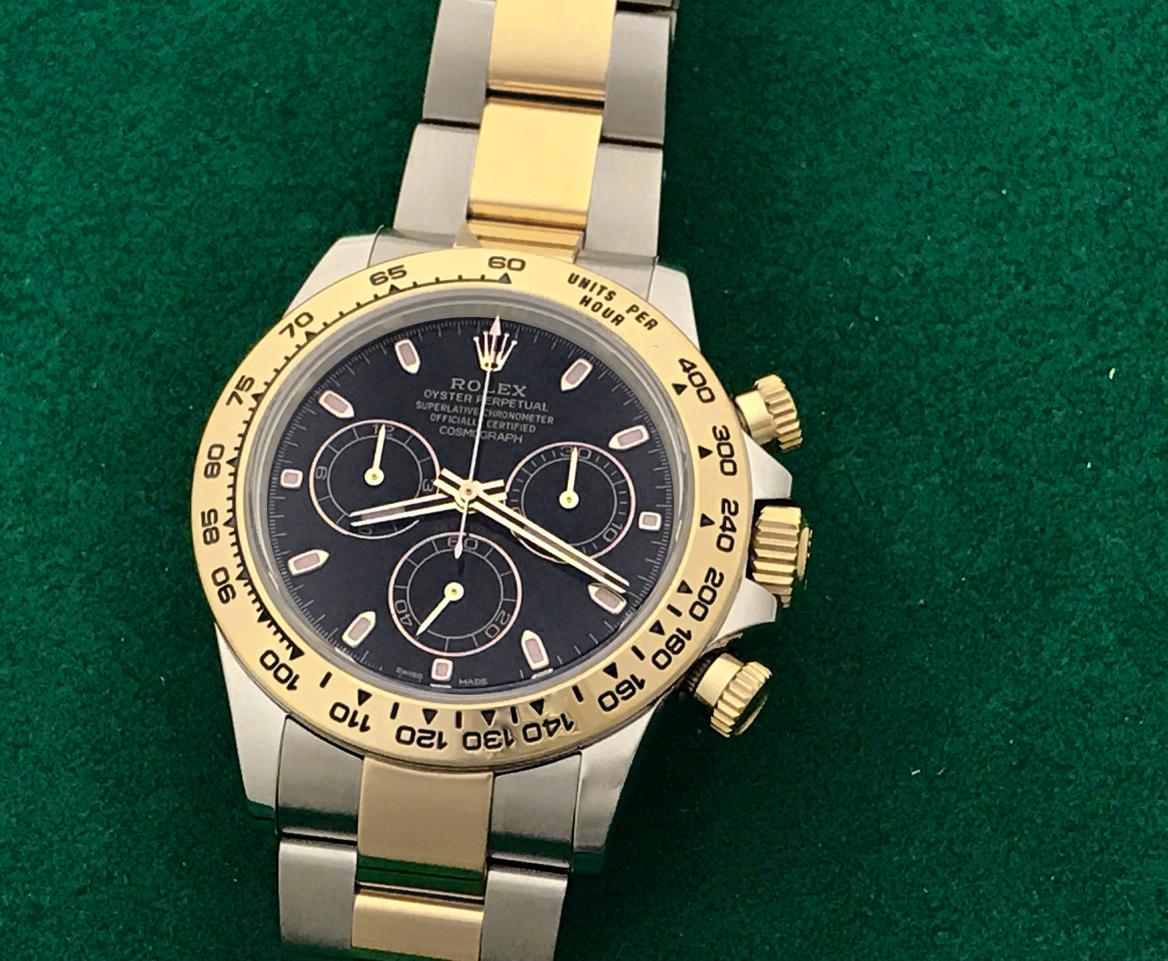 Contemporary Rolex 18 Karat Gold Stainless Steel Daytona Black Dial Automatic Wristwatch