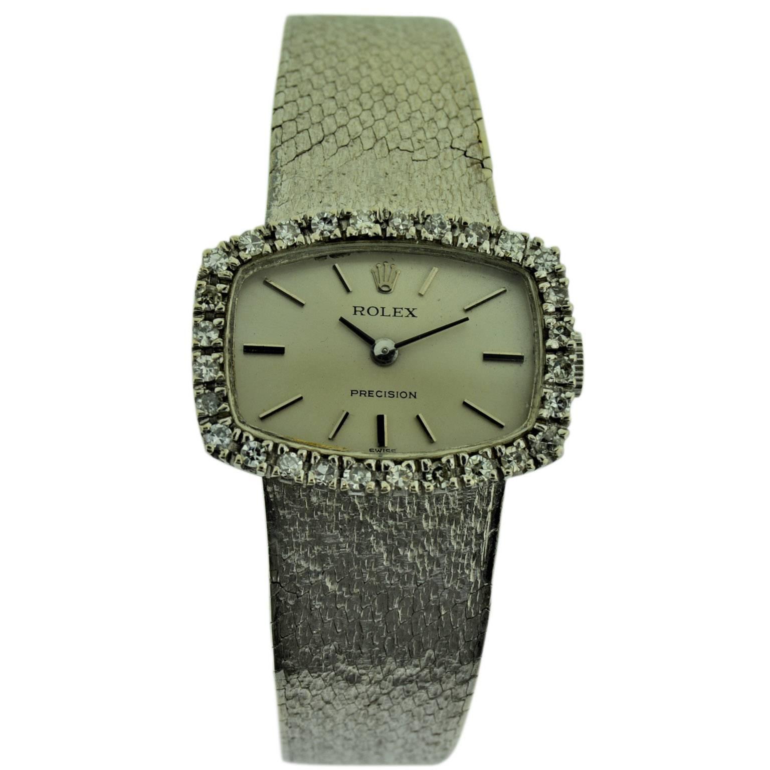 FACTORY / HOUSE: Rolex Watch Company
STYLE / REFERENCE: Ladies Diamond Dress Watch / Ref. 687
METAL / MATERIAL: 18Kt. White Gold 
CIRCA: 1970 / 1971
DIMENSIONS: 24mm X 18mm
MOVEMENT / CALIBER: Manual Winding / 18 Jewels / Cal. 1400
DIAL / HANDS: