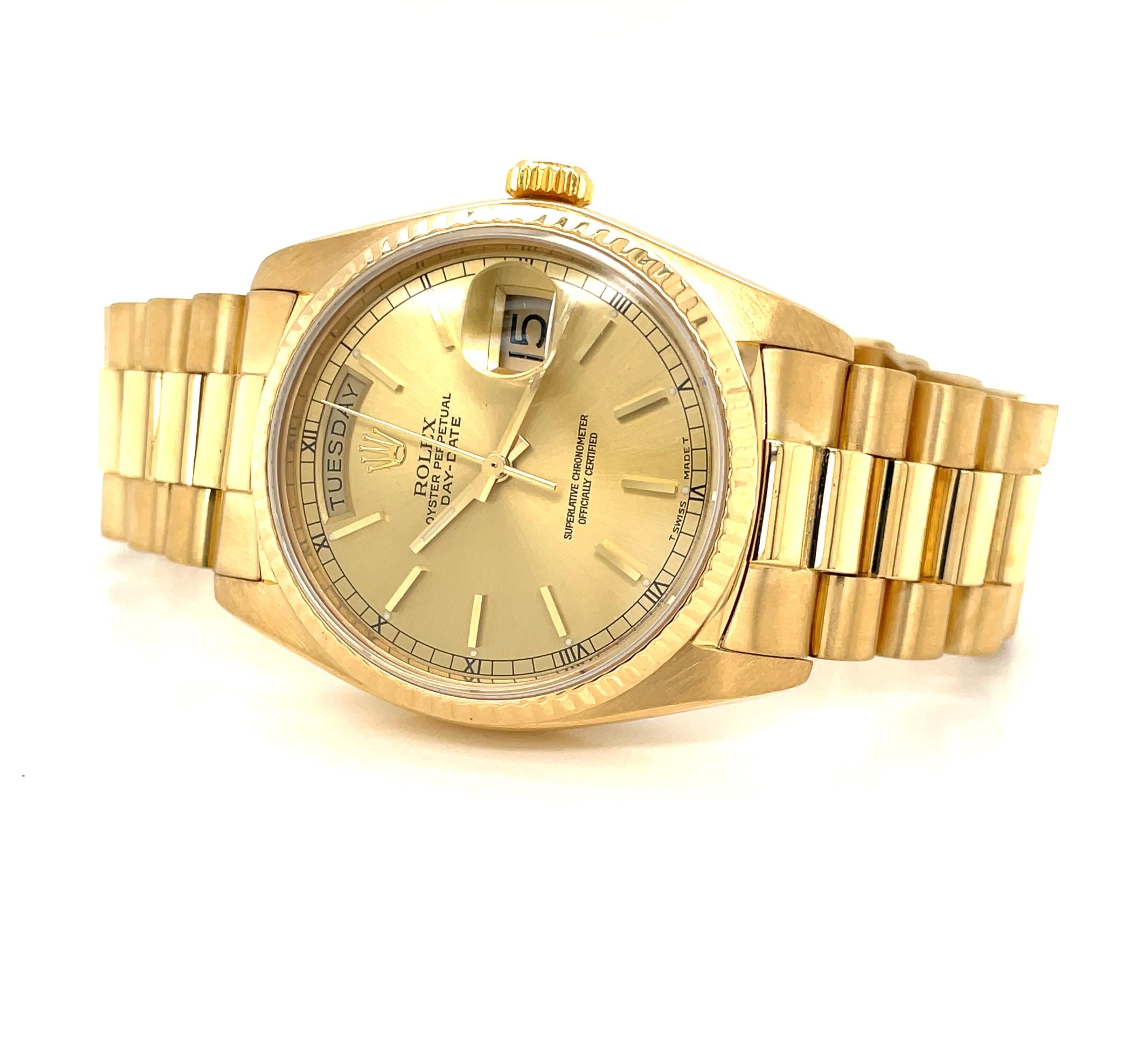In rich eighteen karat 18K yellow gold, enjoy this iconic Rolex President 3055 Oyster Perpetual Day Date 36mm Men's Luxury Wrist Watch Model 18038. Circa 1983, this iconic style by Rolex style was worn by many of the influential movers and shakers