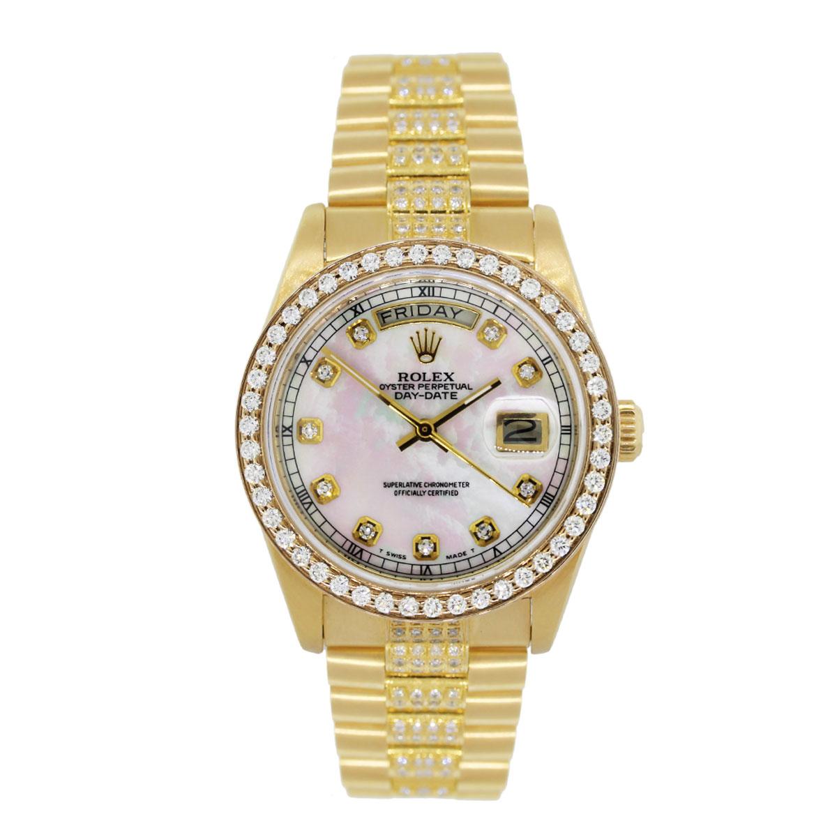 Brand: Rolex
MPN: 18038
Model: Day Date
Case Material: 18k yellow gold
Case Diameter: 36mm
Crystal: Scratch resistant sapphire
Bezel: Diamond bezel (aftermarket)
Dial: Mother of pearl diamond dial (aftermarket)
Bracelet: 18k yellow gold diamond band